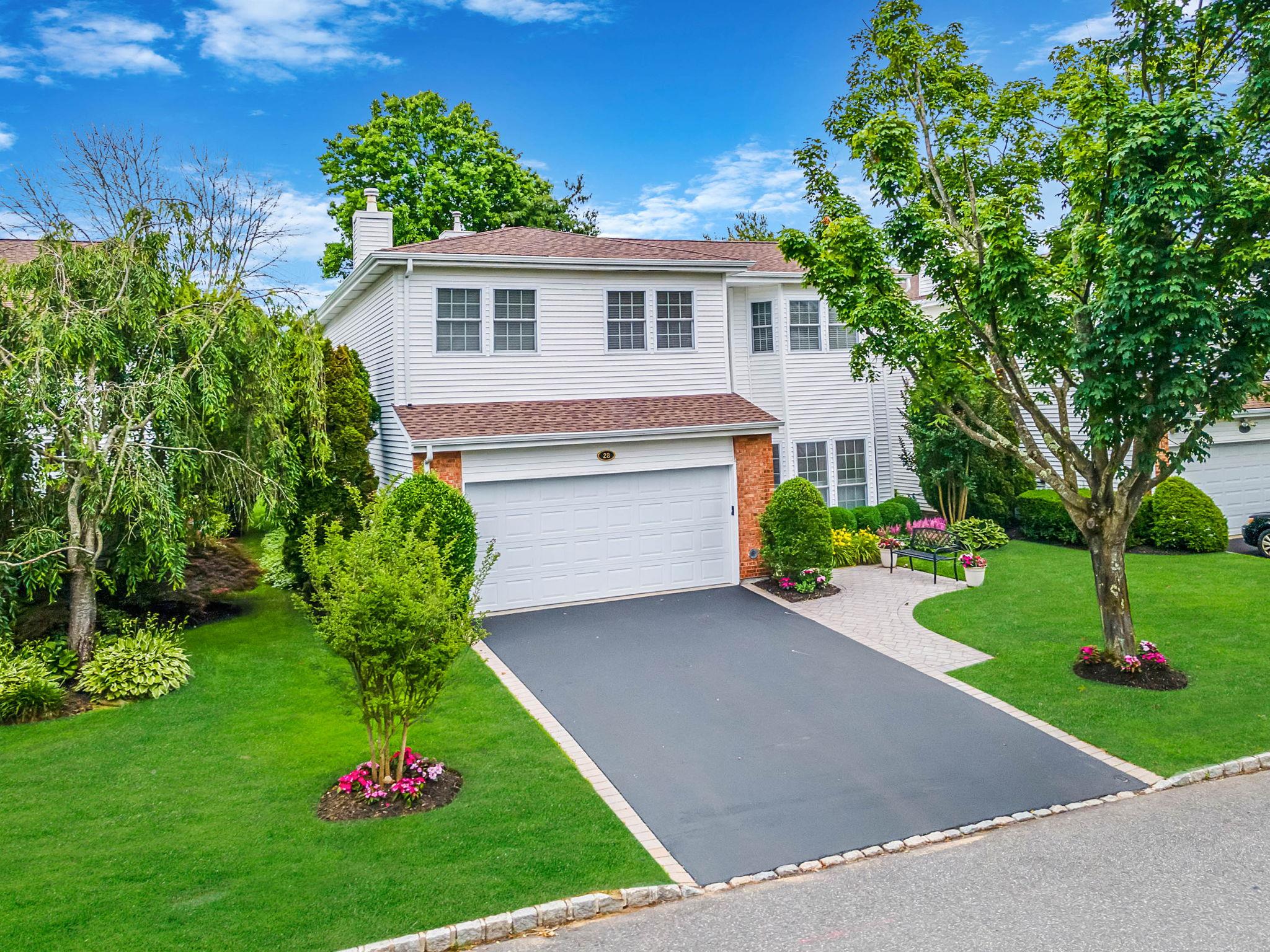 Come see this gorgeous Hamlet Villa! This rare Belair model has a full finished basement and has been beautifully updated from top to bottom with many custom features. The main floor open concept living space is one of the prominent features of this home. The open interior main floor space is flooded with natural light. The impressive custom tiled and chandeliered entryway leads to the main living space which includes arched doorways, custom built-ins and window treatments, a formal dining room, a cozy living room with a wood burning fireplace, and and eat in kitchen, all with beautiful hardwood floors. The updated and redesigned kitchen has granite countertops, tile backsplash, a large island, custom cabinetry and stainless-steel appliances.  The spacious primary bedroom with 2 walk-in closets has a generously sized ensuite spa-like bathroom with custom tile and granite, a double vanity, a large stall shower and a newer soaking tub that overlooks the pristine golf course. The second floor offers 3 additional nicely sized bedrooms, one of which can double as an office. Also on the second floor, is a full bathroom with a stall shower, custom tile and designer accents. Significantly, this Belair Villa has a much sought after full finished basement with plenty of entertainment space, a built-in bar and abundant storage. Situated on the 18th fairway, this home captures the magnificent and tranquil view of the golf course and has a water view. The large paver patio with beautiful landscaping allows for privacy and relaxing enjoyment. Some other prominent features of this home include a new roof, leaders, covered gutters and new AC. Super LOW TAXES! This home is an amazing Hamlet must see! [Social of Golf Membership is REQUIRED to reside in the community. Please see attached Fee Sheet. All Club Fees are to be confirmed with Invited Corp.]