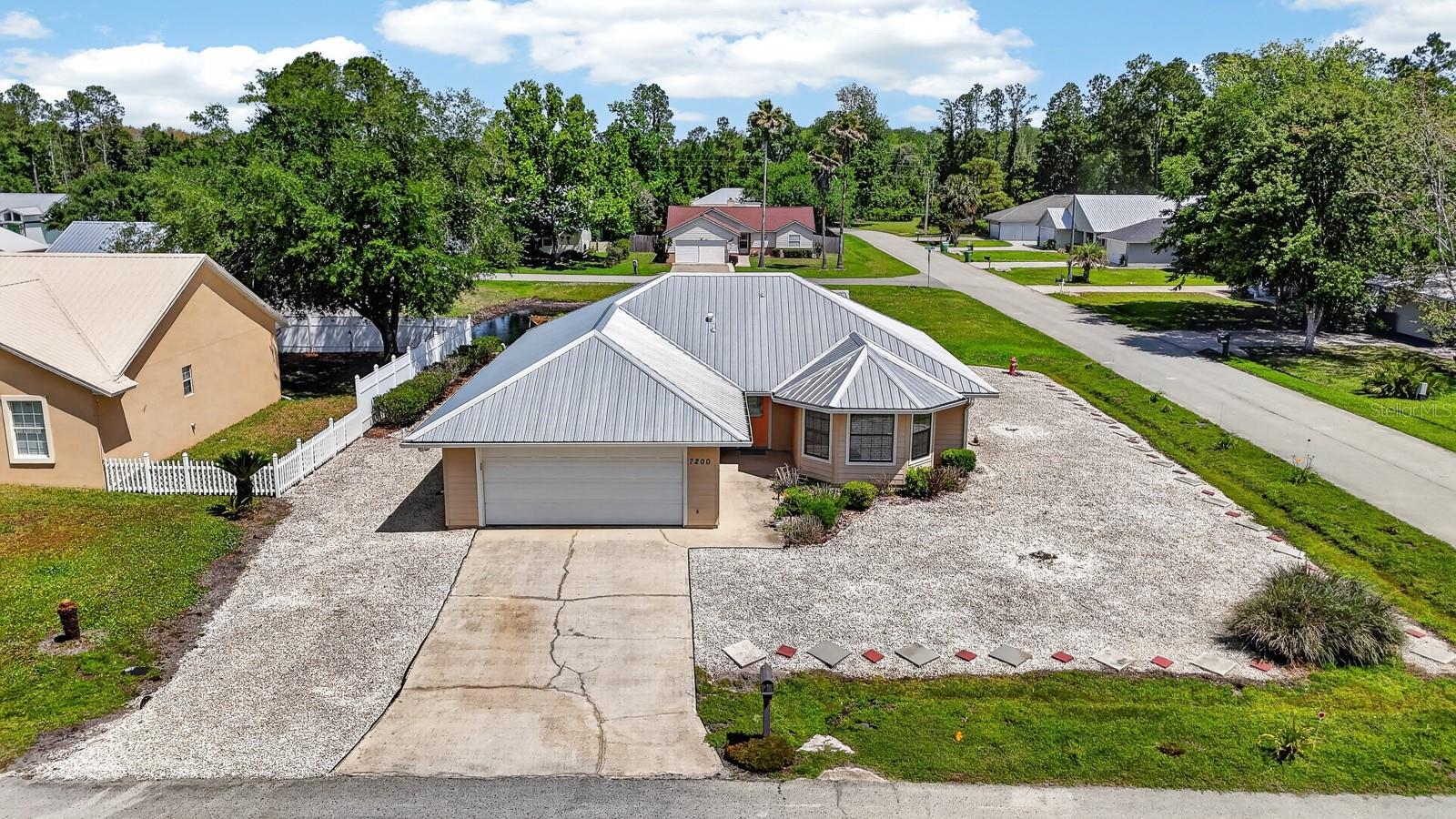 Welcome to this well-maintained 3-bed, 2-bath home in the desirable Tierra Wood neighborhood, offering the perfect blend of comfort, privacy, and freedom with NO HOA. On a corner lot, updated and move-in ready, this home features a new HVAC system from 2022 and a 3 yr old durable metal lifetime roof, providing long-term peace of mind. Inside, you'll find an inviting layout with included appliances such as a Maytag washer and dryer, Samsung electric range, and a Clack 1054 water softener. The home is also protected with annual service from Crescent City Termite Control. Step outside and enjoy your own private outdoor retreat, complete with a large screened-in patio, pea gravel and paver patio perfect for entertaining, a brick firepit, and a beautiful garden trellis surrounded by open yard space. The gorgeous yard includes irrigation tubing with a timer for the front garden, along with a brand-new, clean Graceland storage shed. A large 2 car garage for privacy & storage and the home's location on the same electric grid as the hospital offers an extra level of reliability and convenience.