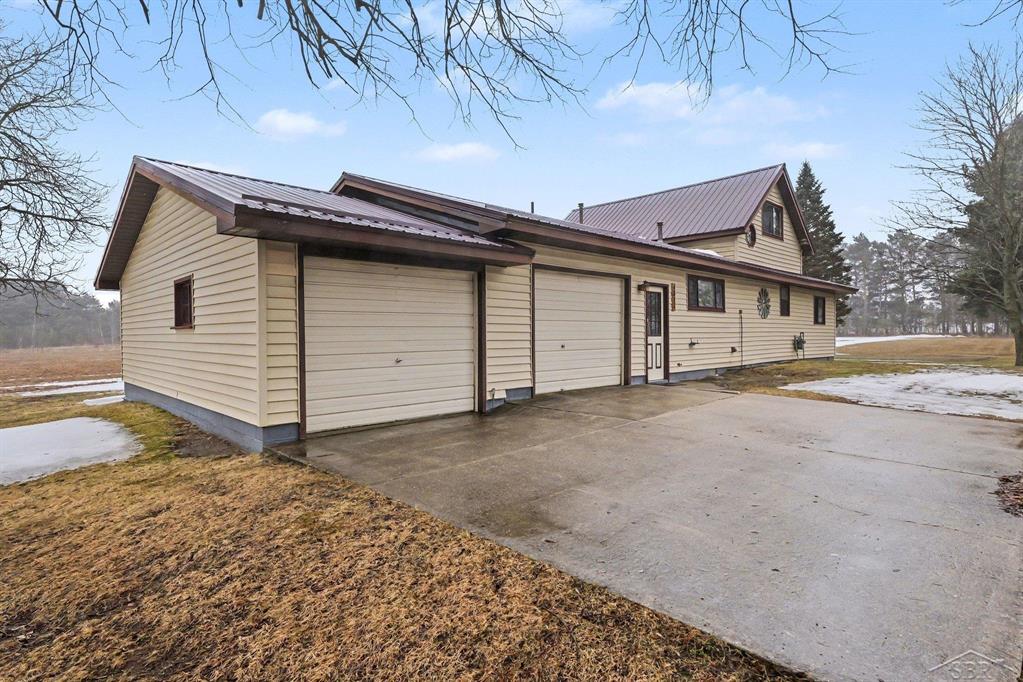 Charming country farmhouse set on 2.5 peaceful acres featuring 3 bedrooms, 1 bath, and a bright four-season enclosed porch that offers a perfect place to relax and enjoy the surrounding views year-round. The home was enlarged and updated in 1985 and features beautifully crafted Lloyd's custom kitchen cabinets that provide both style and functionality. A new roof installed in 2025 offers peace of mind for the next owner, while the home also provides abundant storage throughout. The two-car attached garage offers plenty of space for vehicles, tools, hobbies, or a workshop. With its spacious setting and classic farmhouse appeal, this property is ready to welcome its next family. An adjoining 2.5 acres is also available to purchase for $29,900. Call today to schedule your private showing.