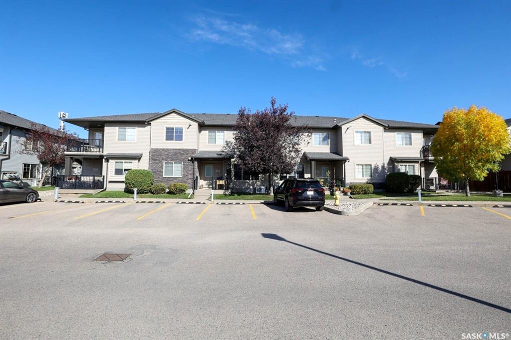 Don’t miss this immaculate and exceptionally well-maintained top-floor condo, ideally located in Regina’s desirable Lakeridge Addition. Situated in a convenient northwest location close to schools, parks, shopping, restaurants, and area amenities, this bright and inviting home is truly move-in ready.The current owner has completed numerous thoughtful updates, including professional repainting, new laminate flooring, and new carpet throughout. The bright, open-concept living area offers a welcoming layout with plenty of natural light.The kitchen features dark cabinetry, laminate countertops, a convenient freestanding island, updated light fixture, and stainless-steel appliances. The spacious living room provides plenty of natural light and direct access to the private deck — perfect for enjoying your morning coffee or relaxing outdoors.Both bedrooms are generously sized and feature new carpet and window treatments, with incredible prairie view. The laundry room provides additional convenient storage and includes a new stackable washer and dryer in 2026.Another valuable feature is the newer tankless water-heating system, which provides domestic hot water while also operating the in-floor heating system. A portable air conditioner is also included for added comfort during warmer months.One of the standout features of this property — and a rare find in condo living — is the convenient single-car garage. Perfect for parking, storage, or both, this is a tremendous added VALUE & benefit, a feature rarely available with comparable units.Bright, immaculate, exceptionally well cared for, and loaded with recent updates, this condo offers comfortable, low-maintenance living in a highly desirable northwest Regina location. Simply move in and enjoy! Call your agent today to schedule a showing.