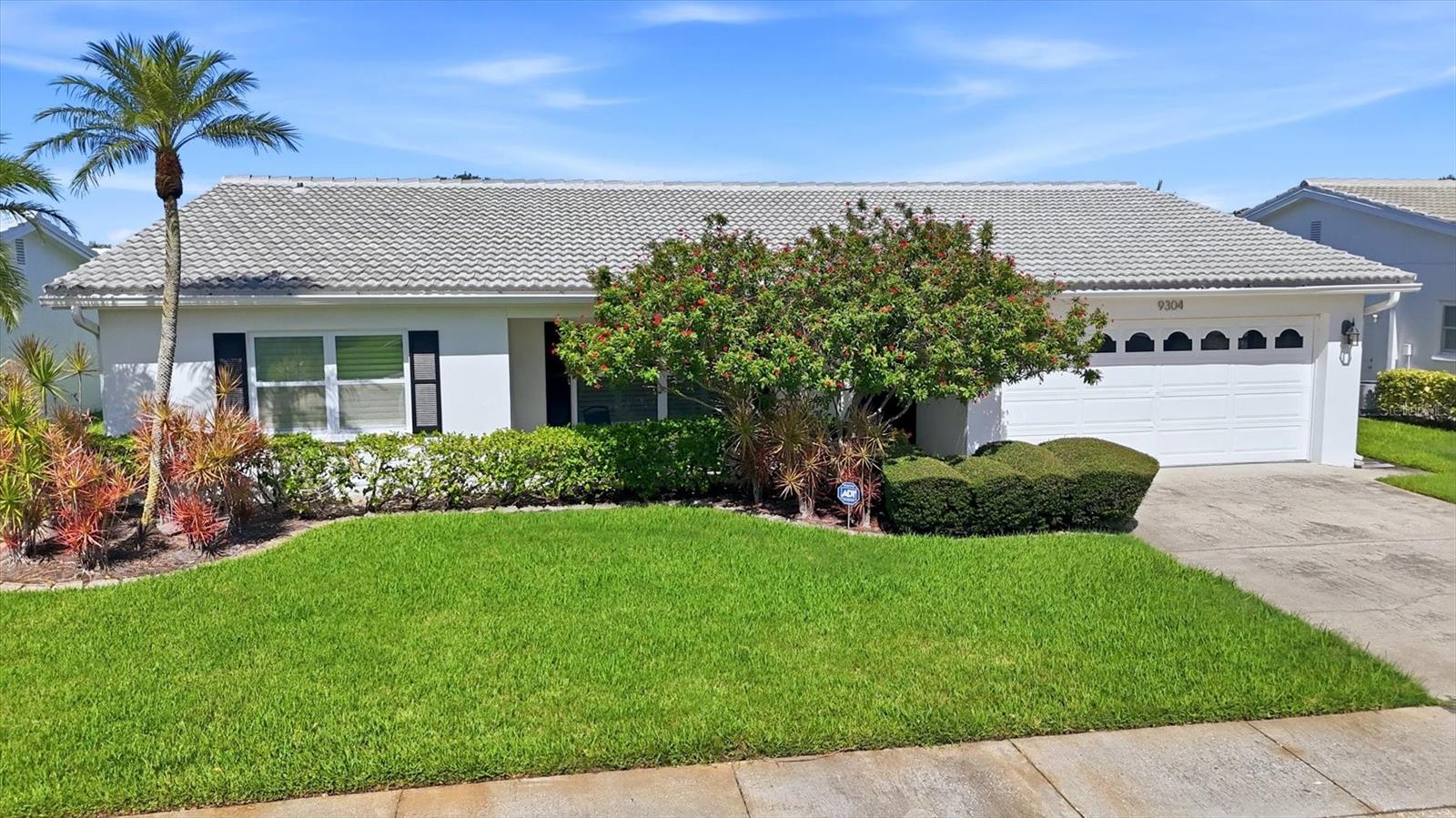 Ready to embrace the Florida lifestyle? Welcome home to The Mainlands of Tamarac, a desirable 55+ golf and pet-friendly community where comfort, convenience, and an active lifestyle come together.  Offering an impressive 1,956 square feet of living space, This Gulfstream home offers 3-bedrooms, 2-baths and is currently one of the LARGEST properties available for sale in the community, giving you exceptional space to entertain, host family and friends, create a home office or hobby room, and enjoy Florida living without compromise. A cozy covered front porch sets the tone and provides the perfect place to enjoy your morning coffee or relax at the end of the day. Step inside to a bright, welcoming interior, freshly painted in August 2026, featuring a formal living and dining area plus a spacious Florida room. At the heart of the home is the beautifully updated kitchen, complete with white cabinetry, granite countertops, breakfast bar, stainless steel appliances, and tile flooring. Both bathrooms have also been tastefully updated. Custom plantation shutters adding timeless style throughout the home. Major improvements offering added peace of mind, include a 2024 ROOF, STORM IMPACT WINDOWS installed in2020, A/C is 2019, and a 2025 WATER HEATER. An indoor laundry and utility room adds everyday convenience, and the TWO-CAR garage provides plenty of room for vehicles, storage, golf clubs, bikes, and more.  It doesn't stop there, The Mainlands lifestyle is just as impressive! Enjoy access to the community's heated in-ground pool, clubhouse, shuffleboard courts, golf course, social activities, and more. With The Mainlands golf course right within the neighborhood, year-round golf is practically at your doorstep.  Love the outdoors? Freedom Lake Park is just minutes away, offering separate dog parks for large and small dogs, scenic walking trails, fitness stations, fishing, picnic pavilions, grilling areas, a playground and so much more. Shopping, dining, coffee shops, fitness centers, are just a few minutes away.  Why settle for less space when you can have nearly 2,000 square feet, valuable updates, a two-car garage, and the Florida lifestyle you've been waiting for? Schedule your private showing today and come see why this exceptional Mainlands home deserves to be at the top of your list. Welcome home!