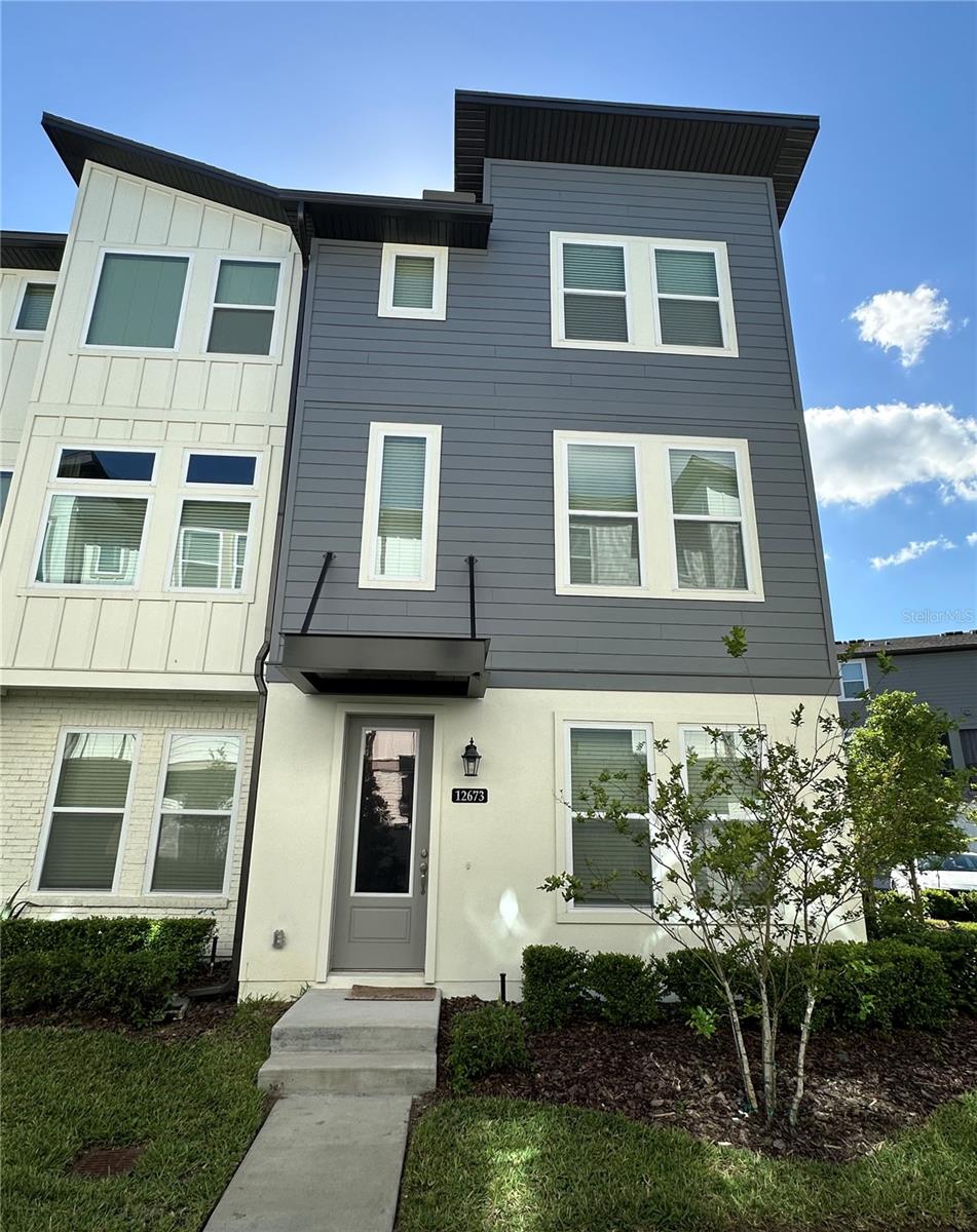 This beautiful Laureta Park Luxury Townhome  move-in ready; it has three bedrooms, three private bathrooms, and a guest half-bath. Has an open layout with ample room for entertaining and a second-level balcony. It is in a great location - blocks from the community amenities, pool, coffee shop, and Canvas Restaurant and Bar. The community of Laureate Park is in the heart of Lake Nona’s Medical City, UCF College of Medicine, the VA Medical Hospital, Valencia College, USTA, and Sports District. The 417 Expressway and Orlando International Airport are nearby.
