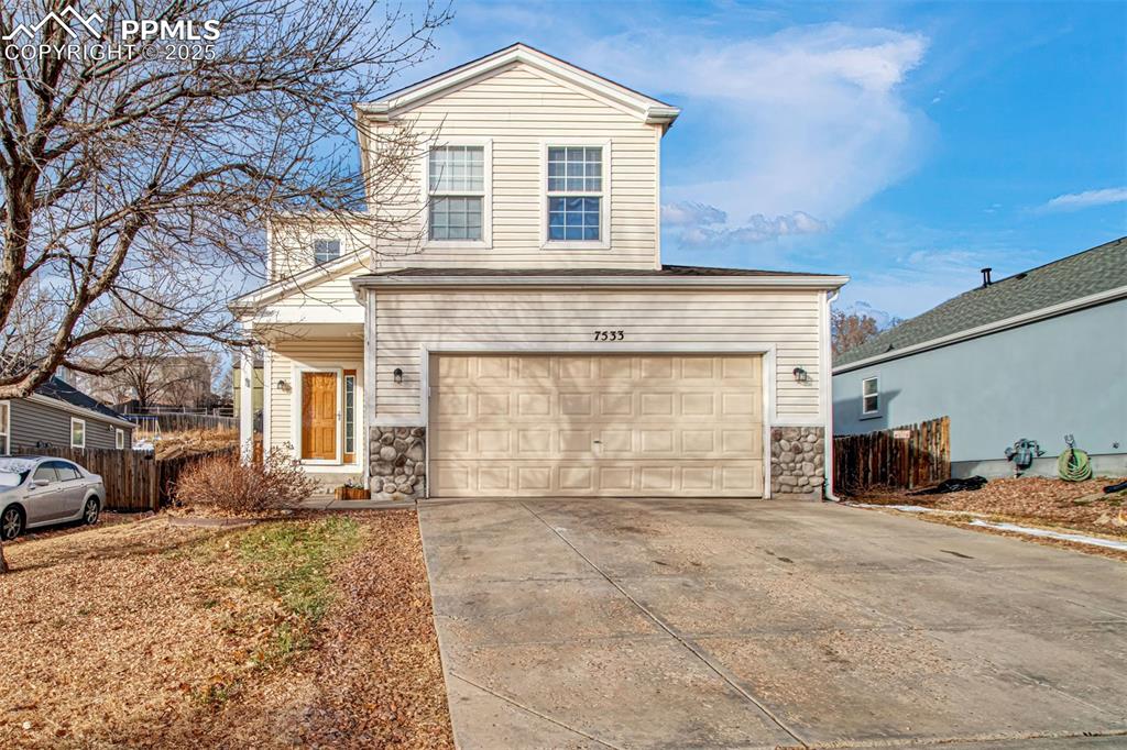 WELCOME HOME to this beautifully updated 2-story home in Fountain, offering 3 bedrooms, 3 baths, and a 2-car garage with shop potential, complete with a workbench and shelving. Located just minutes from Fort Carson, schools, shopping, and parks, this home offers comfort, convenience, and modern upgrades—all with the freedom of NO monthly HOA! Step inside to a bright, inviting main level featuring soaring vaulted ceilings, fresh interior paint, nearly new carpeting, and stunning laminate flooring. The home is filled with natural light thanks to large picturesque windows that create a warm and welcoming atmosphere throughout. The spacious kitchen includes stainless steel appliances, a breakfast bar, a large walk-in pantry, upgraded lighting and fixtures, and flows seamlessly into the dining room/living room combo with a walkout to the backyard. Also on the main level is a powder bath and a dedicated mudroom/laundry space with storage shelves with a door to the garage.The upper level features a primary suite with its own fireplace, walk-in closet, and adjoining bath with double vanities and a tub/shower combo with upgraded shelving. Two secondary bedrooms—each with their own walk-in closet—are conveniently located near the full hall bath also with upgraded shelving. Situated on a spacious 9,590 square foot lot, the backyard offers endless possibilities with plenty of room for a dog run, to garden, play, or entertain.  Enjoy evenings around the stone built-in fire pit, or make the most of the fully fenced yard for pets or outdoor activities. Additional highlights include a roomy crawl space for storage, Leviton Integrated home network system, privacy fencing, upgraded lights and fixtures, custom shelving throughout, and a video doorbell for added convenience and security. With its thoughtful layout, modern updates, abundant natural light, and flexible, no-HOA lifestyle, this home is truly move-in ready and a fantastic find in Fountain!