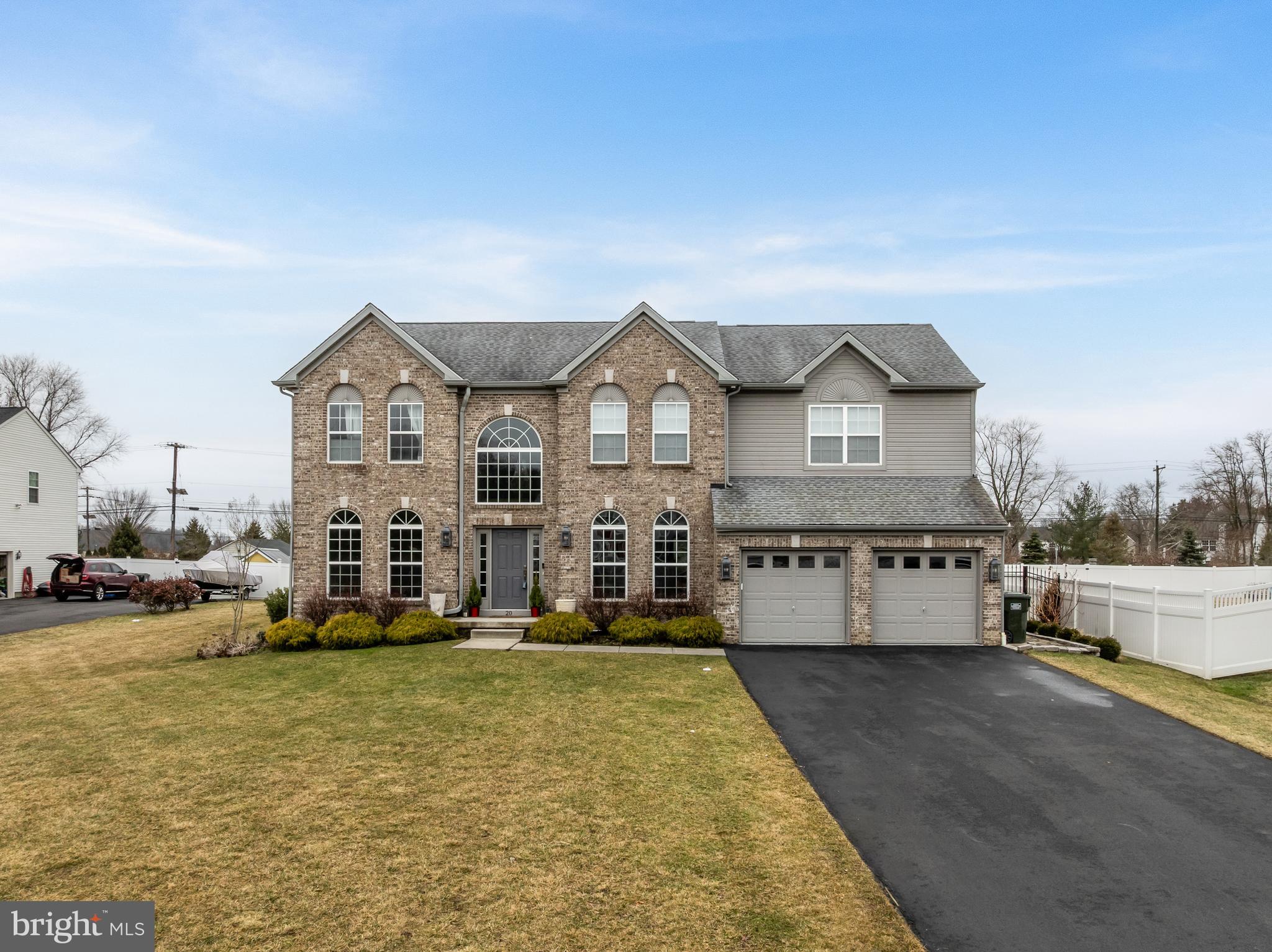 Welcome To 20 Providence Court In Lumberton’s Desirable Waverly Pointe Community. This Exceptional 4 Bed, 3.5 Bath Colonial Was The Original Bruce Paparone Model Home When Built In 2018, Showcasing Custom, High-End Upgrades And Premium Finishes Throughout. From The Moment You Arrive, The Home’s Custom Stonework Exterior And Beautifully Maintained Landscaping Set The Tone. Step Inside To A Dramatic Foyer With Soaring Vaulted Ceilings, Detailed Wainscoting, A Sparkling Chandelier, And A Striking Wrought Iron Staircase. Rich, Dark Engineered Wood Floors Flow Throughout The First Floor, Complemented By Beautifully Detailed Millwork, Neutral Designer Colors, And Stylish Lighting Throughout. Tons Of Large Windows Flood The Home With Natural Light, Creating A Bright And Inviting Atmosphere In Every Room. The Open-Concept Main Level Is Designed For Both Everyday Living And Effortless Entertaining. An Inviting Living Room Is An Ideal Space To Enjoy A Good Book Or Catching Up With Friends And Loved Ones. The Vaulted Family Room Features A Cozy Gas Fireplace And Seamlessly Connects To The Bright Breakfast Area And Stunning Kitchen, Complete With A Stylish Subway Tile Backsplash, Abundant Cabinetry, Massive Island With Seating, And A Glass Sliding Door Leading To The Backyard. Just Off The Kitchen Is A Spacious Mudroom With Tile Floors, A Bonus Utility Sink, Garage Entry, And High-End Speed Queen Washer And Dryer. A Private First Floor Study Provides The Perfect Work-From-Home Space, While The Elegant Dining Room Showcases Classic Wainscoting—Ideal For Gatherings And Holidays. A Convenient Half Bath Completes The First Floor. Upstairs, The Massive Primary Suite Offers A Peaceful Retreat With Vaulted Ceilings, A Huge 14x6 Walk-In Closet, And A Tranquil EnSuite Bath Featuring A Sunken Soaking Tub, Large Vanity With His And Hers Sinks, And Spacious Tile Lined Shower. Three Additional Generously Sized Bedrooms Offer Large Closets And Share A Full Hall Bath With Double Sinks. The Expansive Finished Basement Adds Incredible Versatility With High Ceilings, A Full Bathroom, An Insulated Gym Area, And Additional Unfinished Space Perfect For Storage. Outside, Enjoy A Private Backyard Designed For Relaxation And Entertaining, Complete With A Beautiful Paver Patio And Fully Fenced Yard. The Property Also Includes A Full In-Ground Sprinkler System And A 2-Car Garage. Security And Peace Of Mind Come Standard With Newer Systems Throughout And A Hardwired Camera System Installed Both Indoors And Outdoors. Model-Home Quality, Impeccably Maintained Condition, And A Prime Cul-De-Sac Location — This Is One You Don’t Want To Miss.