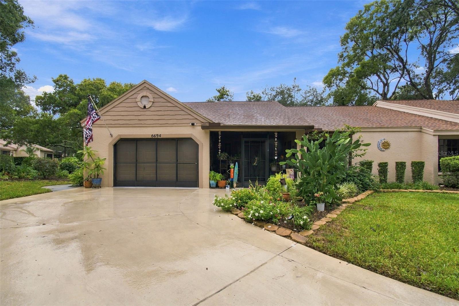 Experience refined golf-course living in one of Florida's most coveted 55+ communities--Timber Pines, an award-winning enclave celebrated for its natural beauty, prestige, and world-class amenities.Beautifully remodeled end-unit villa located on a quiet cul-de-sac, featuring one of the largest lots and driveways in the village. This open-concept floor plan offers 2 bedrooms, 2 bathrooms, and an oversized 1.5-car garage with plenty of room for a golf cart.Enjoy a large front screened-in porch and a gorgeous stone-paver rear patio perfect for entertaining. The expansive side yard is beautifully landscaped and maintained by the HOA. Interior highlights include a formal dining room, an enclosed lanai with heat and air--ideal for a home office or craft room--and a tiled eat-in kitchen with a cozy breakfast nook. Ceiling fans are installed throughout. The primary bedroom and guest suite both feature large walk-in closets, and the primary bath has been remodeled to include a spacious walk-in shower.Major updates include:Roof replaced in 2023Central air replaced in 2022All new double-pane windows installed in 2025Water Softener and kitchen reverse osmosis system in 2024This village also offers its own heated swimming pool for residents and their private guests, and allows up to two dogs.Living in Timber Pines means embracing a luxury resort lifestyle every day. Residents enjoy four championship golf courses, a state-of-the-art fitness center, a 12-court professional pickleball facility, the Lodge Clubhouse, Resident Activity Center, Performing Arts Center, and an exclusive Country Club. The community also features eight lighted tennis courts, two pools with spas--including a multi-million-dollar resort-style pool opening in 2027--and an extraordinary variety of clubs and activities ranging from arts and crafts to bocce, yoga, dance, woodworking, and more.HOA fees include Spectrum cable (three boxes) and high-speed internet.This exceptional property is priced to sell--an outstanding opportunity to own a beautifully updated villa home in one of Florida's premier active-adult communities. Schedule your private tour today.