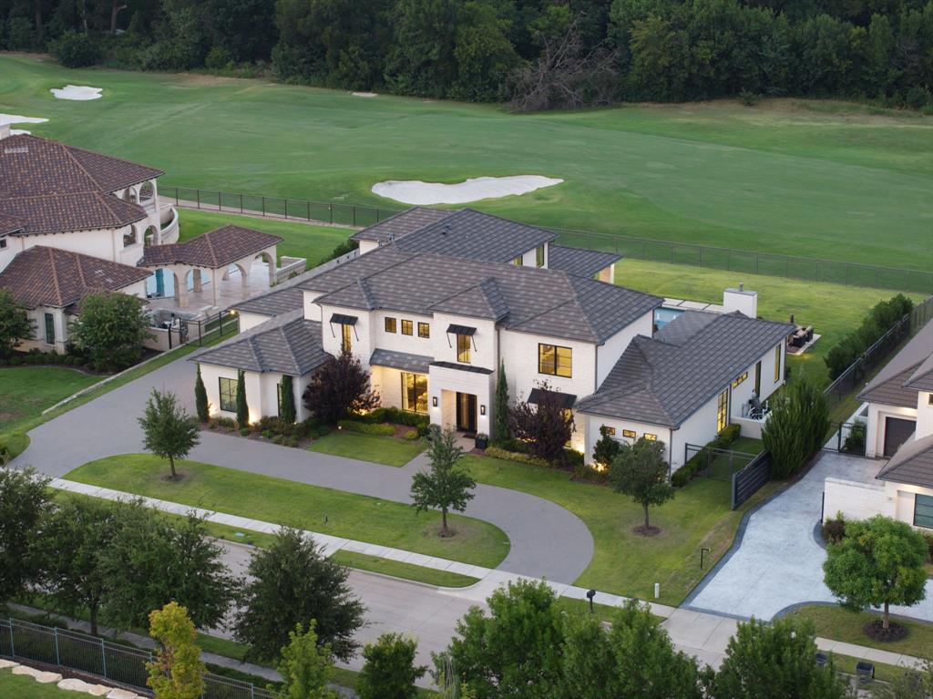 FABULOUS PRICE IMPROVEMENT. Newer construction, golf course lot, an incredible opportunity to own in the prestigious guard gated community of Wimberly Place, AND SELLERS ARE ENTERTAINING ALL OFFERS! Come back and take a look at this true custom-turn key offering with unique privacy and top-of-the-line construction throughout on a premier Twin Creeks golf course lot. This newer estate maximizes its footprint while leaving plenty of grass for entertaining and outdoor enjoyment. Multigenerational layout with the most desirable design trends and timeless appeal, blending transitional and modern accents. Enter through tall French iron doors into a light-filled interior where floor-to-ceiling glass showcases the resort-style pool and outdoor living areas, perfect for relaxation year round. Chalky white museum-smooth walls, wide-plank white oak floors create a gallery-like backdrop for art and beautiful everyday living. The open kitchen, breakfast area, and family room connect seamlessly with a large walk-in bar, theater, and butler’s pantry-all viewing the extraordinary back yard. The oversized primary suite offers a private retreat with spa-like ensuite bath and enormous closet, while a separate junior primary in-law suite sits on the opposite wing for privacy. Upstairs, a spacious lounge and game area connect to three well-appointed ensuite bedrooms, a secondary laundry room, creating an ideal layout for modern living. Built with extraordinary attention to detail and structural integrity by the sellers, including over 100 piers, foam insulation, concrete tile roof, imported stone flooring, select white oak floors, level 4 countertops, Wolf-SubZero appliances, built-in Miele coffee maker, two dishwashers, designer lighting, and tankless water heaters, EV charging stations. Priced below recent sales and turn-key for immediate occupancy. An exceptional opportunity to own in highly regarded Allen ISD and the golf community of Twin Creeks with easy access to all major roads.