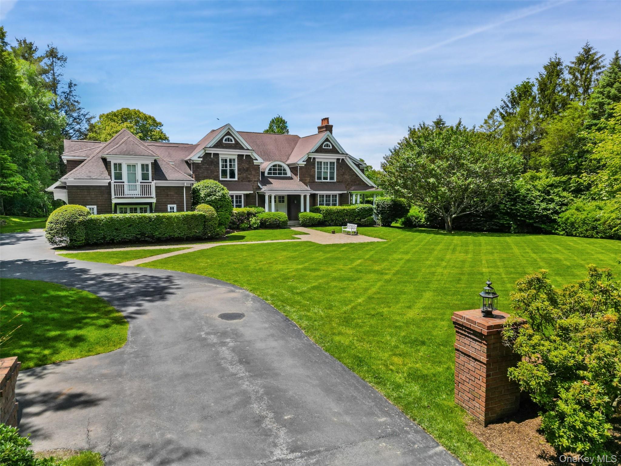 Located in the coveted Whippoorwill estate area, 61 Carolyn Place presides on 2.19 manicured acres and overlooks the Whippoorwill Country Club’s private golf course. Meticulous details abound with lofty ceilings and spacious rooms, complemented by warm, inviting, intimate spaces and outdoor areas. An open gourmet kitchen and breakfast room flow to the grand two-story family room and dedicated solarium, both accessing a large outdoor deck and rocking chair porch. The second-floor features a large primary suite with a gorgeous, sun-drenched bedroom complete with western-views and a wood burning fire place. A sitting room/second office, double walk-in closets, and a lavish bath with a jacuzzi tub, dual vanities and a spacious shower complete the suite. A wide hallway spanning the breadth of the home gives access to two additional ensuite bedrooms, the upstairs laundry room, and home office. The home’s eastern wing, features the final two bedrooms, connected by a Jack-and-Jill bath and features a Juliet balcony overlooking the front yard. A heated, three car garage, connecting mudroom, and full, walk-out basement complete the interior, while the expansive front and backyards feature vast rolling lawns, beautiful scenery, and a potential pool site. The home's assessment has been grieved to correlate to the original list price of $2.8M and will take effect in April 2026. This will substantially lower the property taxes with opportunities to further reduce the assessment in June of 2026. The home is conveniently located between Chappaqua and Armonk, close to town and highways, and approximately 50 minutes to NYC, 61 Carolyn Place is a truly remarkable home and not to be missed.