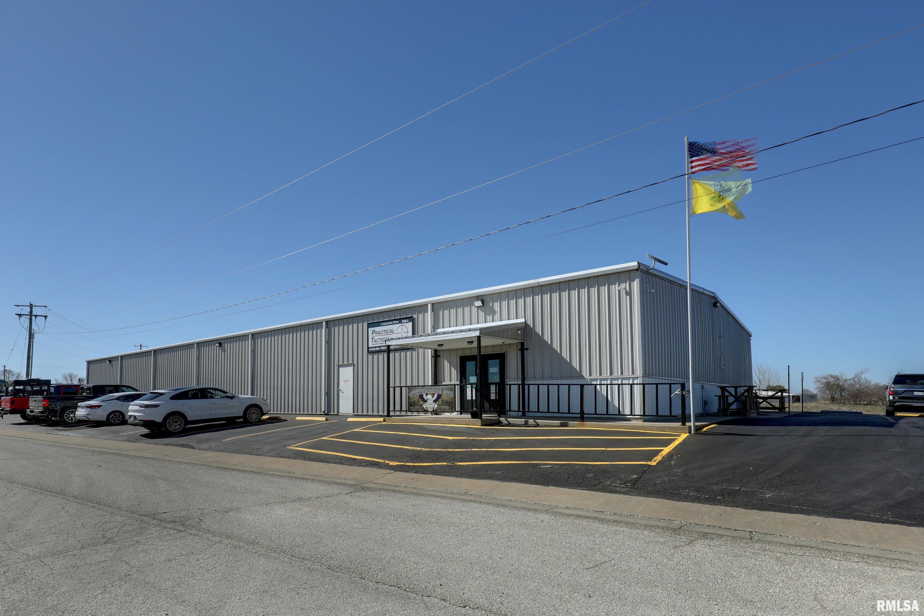 Exceptional opportunity to acquire a purpose built indoor shooting range facility offering immediate income potential in the established LaGrange, MO Industrial Park. This ±9,000 square foot building sits on 1.4 acres of frontage with ample on-site parking (25 spaces) and is designed for both performance and durability.  This state-of-the-art indoor range facility with advanced tactical targeting systems features five 50-yard rifle lanes and eight 30-yard pistol lanes, all equipped with programmable shooting capabilities for dynamic training and customizable user experiences. Constructed with 9-inch concrete walls, the range is fully outfitted with ballistic rubber lining and a rubber bullet trap system, and is rated up to .338 Lapua, accommodating a wide range of firearms use.   Approximately 1,000 square feet is dedicated to retail, classroom, and office space, creating additional revenue opportunities through training, merchandise, and memberships.  Additional highlights include:  • Metal exterior construction for long term durability  • Three-phase, 800-amp electrical service  • City water and sewer  • High end professional grade ventilation system designed for indoor range use  • Tactical programmable Range Systems™ targeting throughout  This property is ideally suited for investors or owner-operators seeking a high-demand recreational and training facility with immediate income potential.