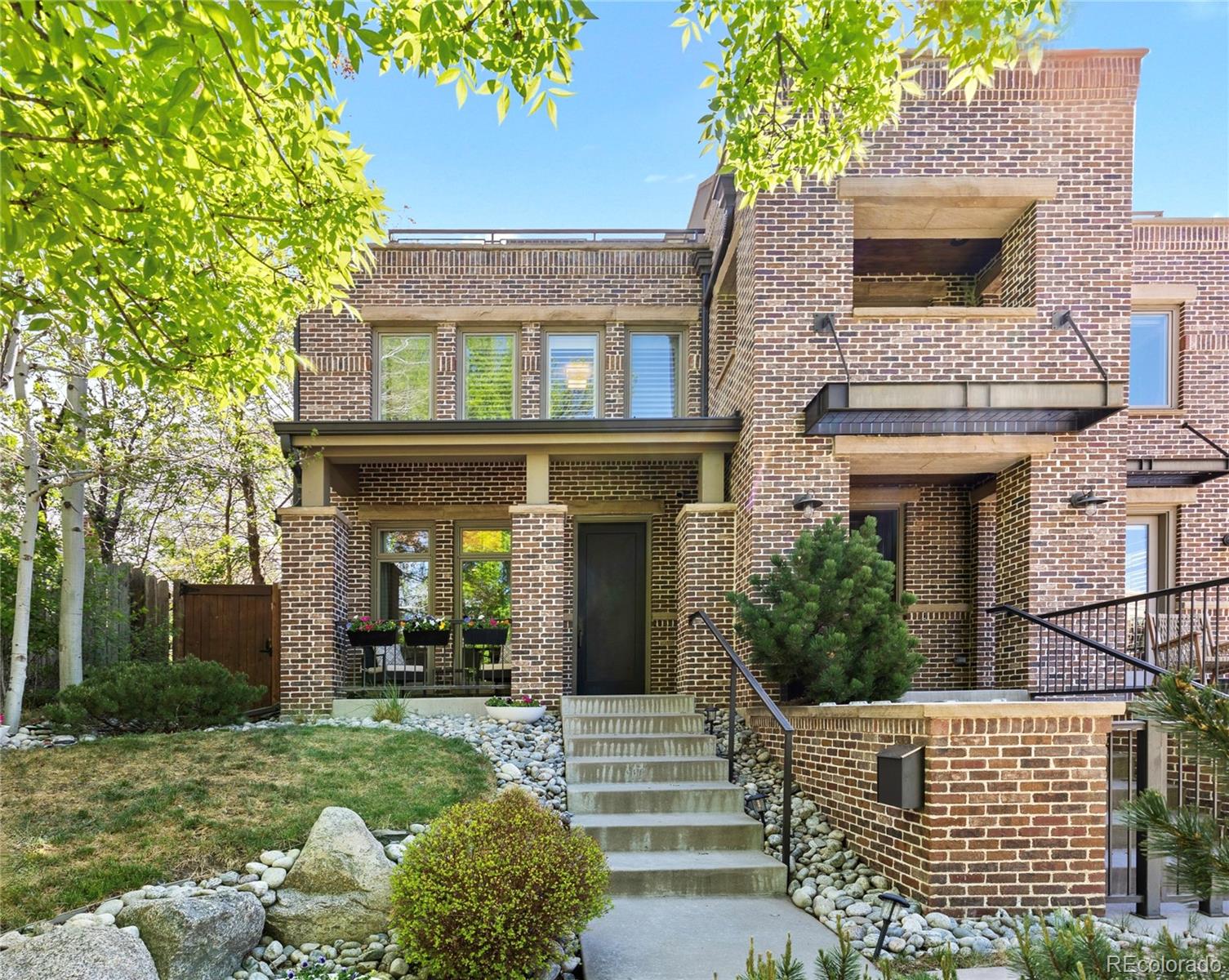 Timeless elegance meets unbeatable Wash Park living at 1090 S Race St. This stunning ½ duplex with a rare rooftop deck sits in one of Denver’s most coveted neighborhoods, offering exceptional curb appeal, high-end finishes, and thoughtful design across all 3 levels.Step inside this beautifully appointed 4 bedroom, 4.5-bathroom home to a formal dining room and a spacious chef’s kitchen equipped with a large island, top-of-the-line Wolf and Sub-Zero appliances, with custom built-ins & ample storage space.The kitchen opens seamlessly onto the living area, where a gas fireplace and floor-to-ceiling doors fill the space with natural light and warmth, creating an effortless connection to the back patio. An ideal outdoor setting for grilling, dining al fresco, or relaxing with friends and family.Upstairs, the primary suite with its own fireplace offers a generous walk-in closet and completely remodeled en-suite bathroom; featuring dual vanities, a large soaking tub and glamorous tile throughout. A spacious second bedroom with its own en-suite bath completes this level.On the third floor, this flexible open space can serve as a 4th bedroom or a home office, complete with its own ¾ bath and access to the stunning west-facing rooftop deck. A private outdoor retreat with mountain views and a front-row seat to Colorado’s most breathtaking sunsets.The fully finished basement adds even more living space, featuring a bonus/media room ideal for movie nights or game days, along with an additional bedroom and en-suite bath with convenient dual access from the hallway—perfect for guests.A 2-car detached garage completes this exceptional home.Located in the heart of Wash Park East, you’re just two blocks from Gaylord Street’s charming restaurants, coffee shops, and boutiques, and only four blocks from the iconic Wash Park itself. This is Denver living at its finest!