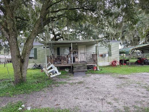 "AS IS". If you are looking for a little peace and quiet, this is the property for you. Own this 1.26 acre perfectly located between Wesley Chapel and Zephyrhills, giving you privacy but yet close to everything. The home does need some TLC, giving you the opportunity to make it your own or finally have your dream home built. Plenty of open and clear space for all of your toys. Investors easy flip. This one won't last, so please call to schedule your showing ASAP before its gone. CASH ONLY. Possible owner financing. SELLER MOTIVATED, MOTIVATED, MOTIVATED!!!!!! ALL OFFERS WILL BE CONSIDERED.