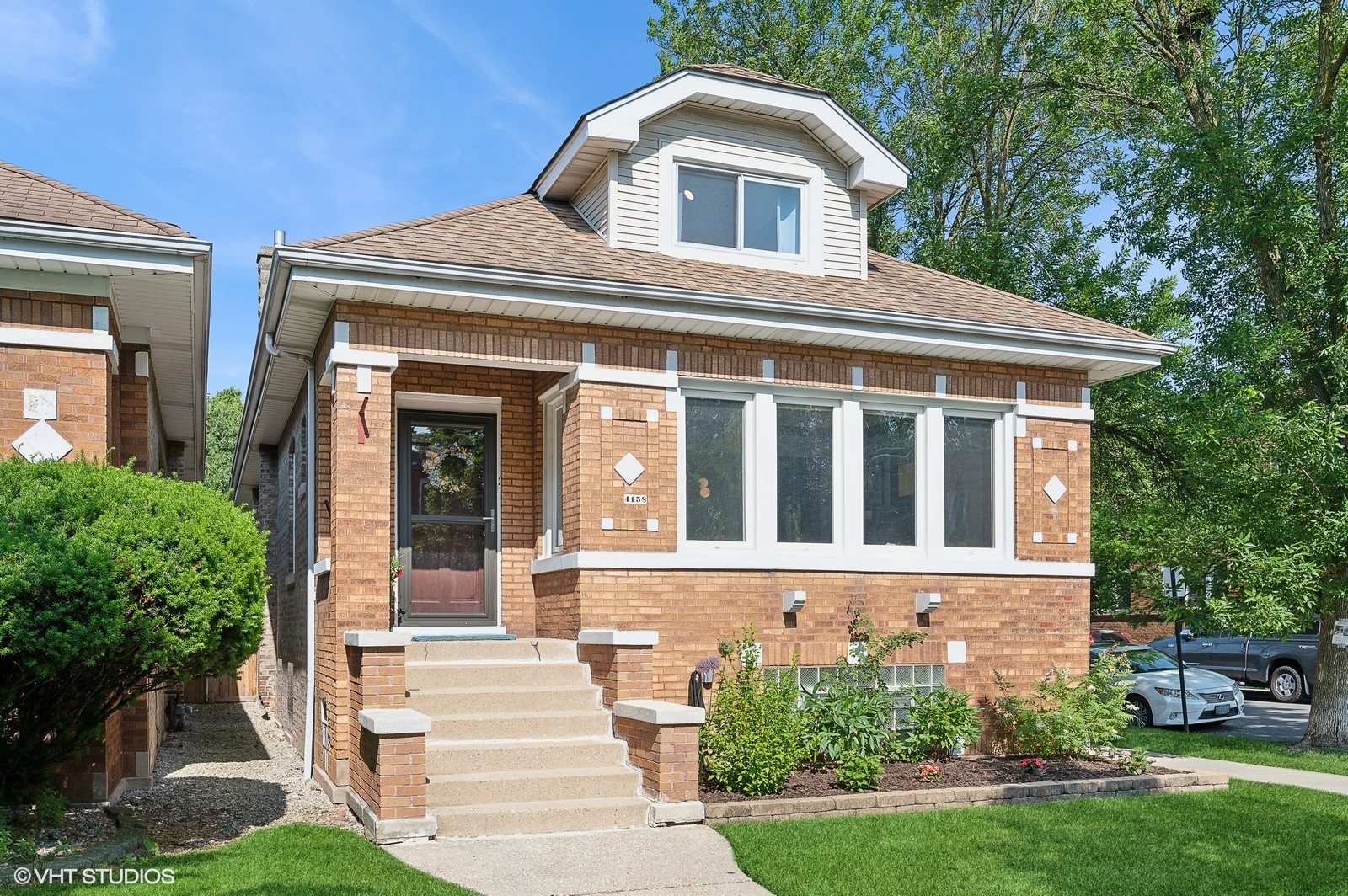 Welcome to this oversized classic Chicago-style bungalow on a CORNER lot in the highly desirable Portage Park neighborhood! The main floor features a spacious living room with a decorative fireplace, a bright and sunny dining room, three well-sized bedrooms, a full bathroom and a beautifully updated kitchen! You'll love the hardwood floors, original trim, crown molding, custom window treatments and high ceilings throughout. This home beautifully blends vintage charm with modern amenities! Upstairs (renovated in 2018), you'll find two generously sized bedrooms, another full bathroom, and a den perfect for an office, play room or in-house yoga studio! Additional features include a newer roof and windows (2015), NEW central A/C (HVAC 2024), updated appliances (2020), updated lighting, in-home washer/dryer and a huge unfinished basement brimming with potential for customization. TONS of storage throughout the home, along with a 2.5 garage featuring a party door opening up into the backyard -great for outdoor entertaining. Situated on a wider corner lot, the home offers an additional parking pad and is conveniently located near public transportation, parks, major highways, schools, shopping and all the dining and nightlife that Portage Park has to offer! Schedule your showing today!