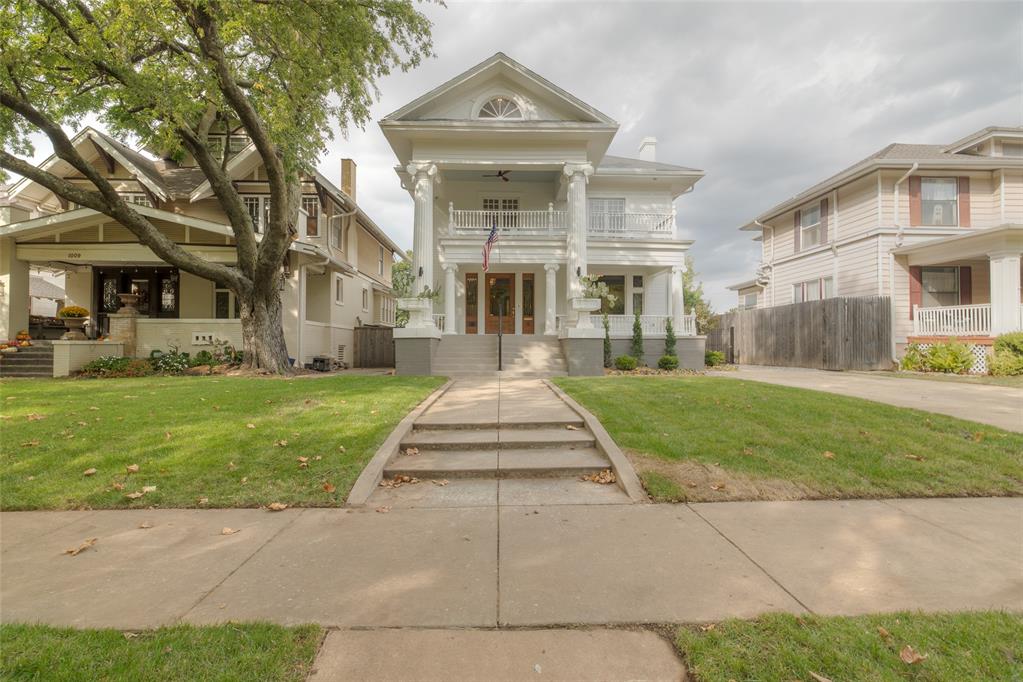 Step into history with the Milton Scott House, c. 1907, the only Greek Revival residence in Mesta Park and a true architectural treasure. 
Spanning over 3,800 square feet, the residence offers four bedrooms, 4.1 baths, and a mindful balance of formal and casual spaces. The home’s gracious covered porches invite an outdoor lifestyle, with the second-story porch providing a stunning bird’s-eye view of Mesta Park’s famous tree canopy and Shartel Boulevard. A meticulous 2024 renovation honors the home’s classical roots, preserving the original interior columns, ceiling frieze, trim work, leaded windows, staircase + balustrade, porch railings, and oak floors, while integrating countless modern comforts. The revitalized and improved kitchen features a 48 inch range,  chef’s island, panel-ready appliances, appliance garage, and custom storage. The cherry on top is the unlacquered brass library ladder, offering a chic way to utilize the upper cabinets. The bathrooms are replete with contemporary finishes like marble, patterned ceramics, stained wood vanities, and ample storage; heated floors give the primary bathroom an added luxury touch. Household updates include new electrical and gas + emergency shut offs, new meters, spray foam insulation, updated plumbing, and beyond. 
Upon crossing the gracious front porch, guests enter the home via a large and welcoming foyer, beyond which lies the formal living, dining, kitchen, and powder bath. The finished basement offers a bar, den, hidden safe room, bedroom + closet, and full bath. The second level is occupied by a laundry, two guest bedrooms, hall bathroom, and primary suite. The front-facing bedrooms share access to the expansive second floor porch. The third floor has been finished and includes a full bathroom, closet, and attic storage.
Mesta Park is one of Oklahoma City's most beloved neighborhoods and is home to some of the city's oldest addresses.

Open today, 11:00 AM-1:00 PM.