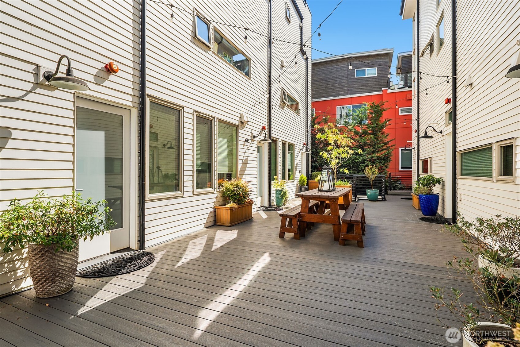 Exceptional North Capitol Hill townhome where modern design, incredible views and a connected Seattle lifestyle come together. Built in 2018, this 1,560 sq ft corner residence offers 3 bedrooms, 2.5 baths, secured garage parking and a dedicated storage unit. Expansive windows capture sweeping Lake Washington views from the UW to Bellevue while filling the home with natural light. Wide-plank oak hardwoods, soaring ceilings and designer lighting create a clean, contemporary feel. The chef’s kitchen features a gas range, quartz countertops and a sleek stainless workspace, perfect for everyday living and entertaining. The serene primary suite enjoys lake views, a walk-in closet and spa-inspired bath, while two additional bedrooms offer flexibility for guests or a dedicated home office. Unwind or entertain on the panoramic rooftop deck with spectacular lake and Eastside views. Enjoy the shared courtyard and an unbeatable location moments from Volunteer Park, Louisa Boren Lookout, cafés and dining, with convenient access to South Lake Union, downtown, UW, light rail, I-5 and 520 for an easy Eastside connection.