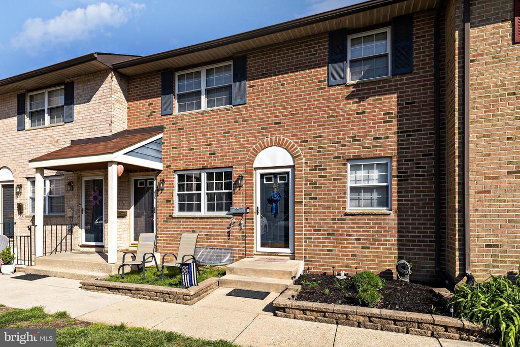 This beautifully updated first-floor condominium offers in-unit laundry, newer flooring, crown molding,  and sleek wafer lighting. The HOA includes water, lawn maintenance, snow removal, common area maintenance and residents enjoy a range of amenities, including a pool, playground, tennis, and basketball courts. Nestled off the beaten path, the community provides a peaceful retreat while still being just minutes from shopping and dining. Plus, enjoy a charming front area perfect for relaxing or grilling. Don’t miss out on this perfect blend of comfort and convenience. There is even a basement for all of your storage needs! Schedule your tour today!