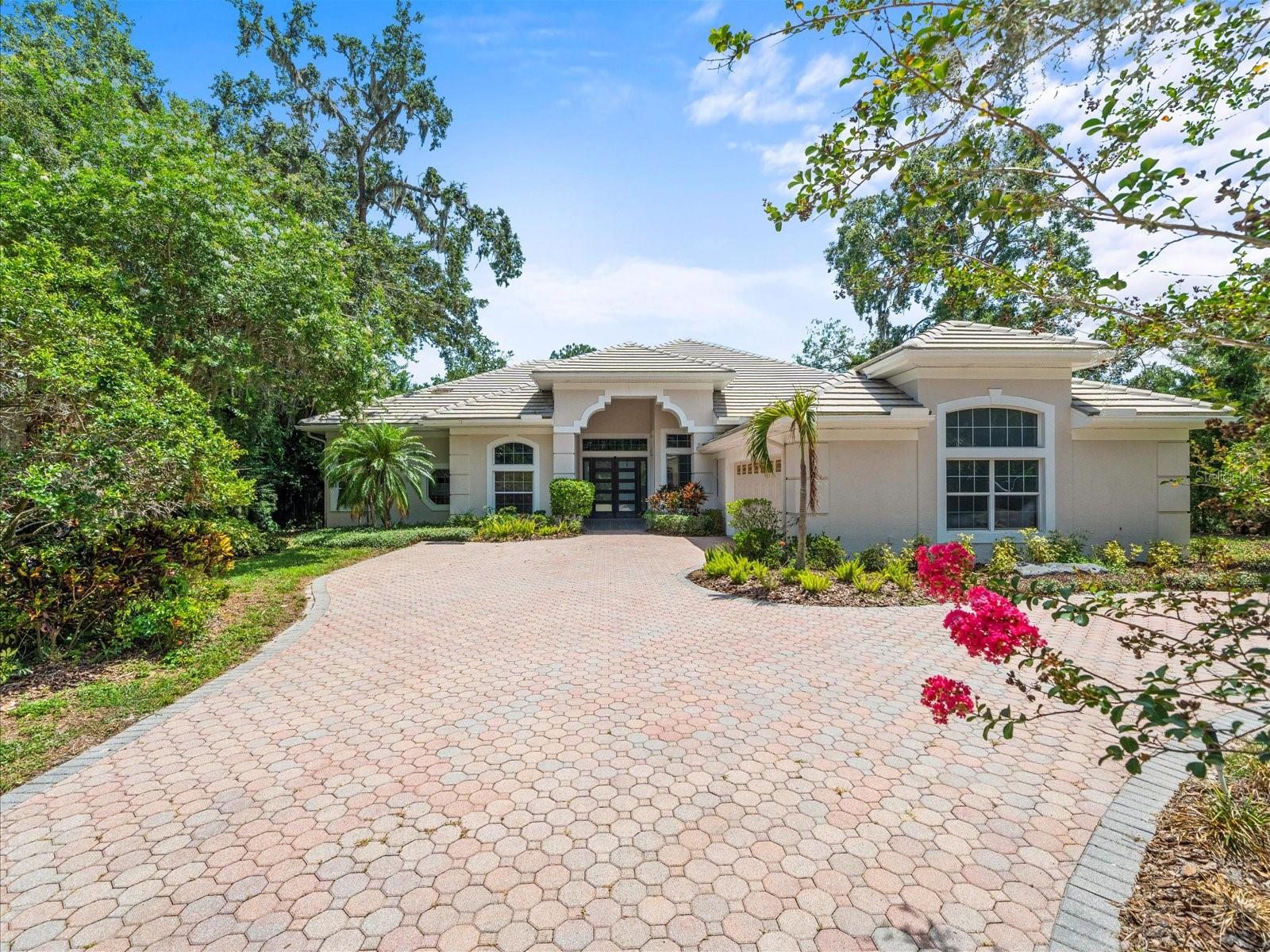 We are pleased to present this amazing opportunity to live on the HILLSBOROUGH RIVER in Temple Terrace.  Situated on a large lot (.40 acres) with beautiful views of the river,  this 4 BEDROOM, OFFICE, 3.1 BATH, ONE STORY custom built home with 3,659 sq. ft. of spacious living, features an open, light and bright floor plan with high ceilings throughout; French doors and transom windows; UPDATED KITCHEN AND PRIMARY BATH; crown moulding; tile flooring that looks great and is easily maintained (no carpet); 2 HVAC systems; large screened lanai great for entertaining; OVERSIZED 2 car garage; paver circular driveway; lush landscape and more!
Add to these NO REQUIRED HOA FEES or CDD FEES and a CONVENIENT LOCATION for schools, parks with access to the Hillsborough River, the Temple Terrace Golf and Country Club, shopping, dining, medical facilities (USF, Moffitt, AdventHealth and the VA hospital), and interstate travel, and you have a fantastic place to call home!