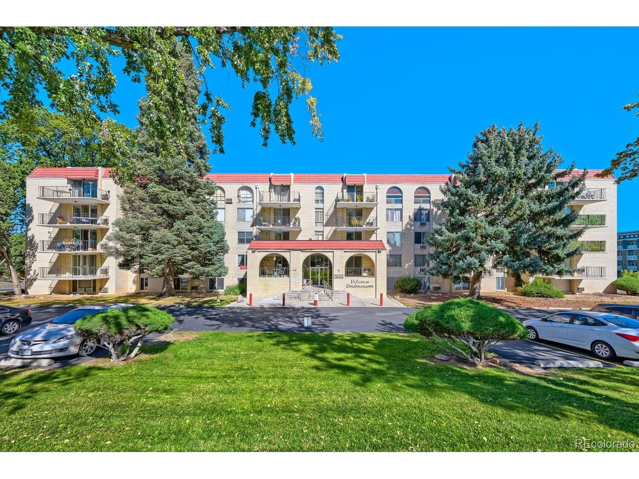 Unbelievable price for this SPACIOUS first floor, 2 bedroom, 2 bathroom 55+ community condo in the heart of Wheat Ridge!  It is minutes to everything you need. The entire building shows pride of ownership from each of the current residents in this great community.  It is a well kept, clean environment with laundry rooms on every floor; there's even a handful of residents that have enjoyed living in Valencia for decades... proving how much this community is enjoyed by the individuals that live here.The condo is freshly painted with newer carpeting recently installed. It has generous closet space, a south facing deck and a spacious dining and living room. You will find this cheery condo to be light filled in every room. There is a designated parking space under the carport, a storage unit, huge swimming pool, sauna, workout room, community room for your own enjoyment or community gatherings.The new Intermountain Hospital, King Soopers, Safeway, restaurants, parks, restaurants,shopping, I70 and 6th Ave...even the mountains and downtown Denver are only minutes away! It would be difficult to find a better location.Come view and see for yourself...you'll want to make this friendly and safe living community the place you will want to call your next home.