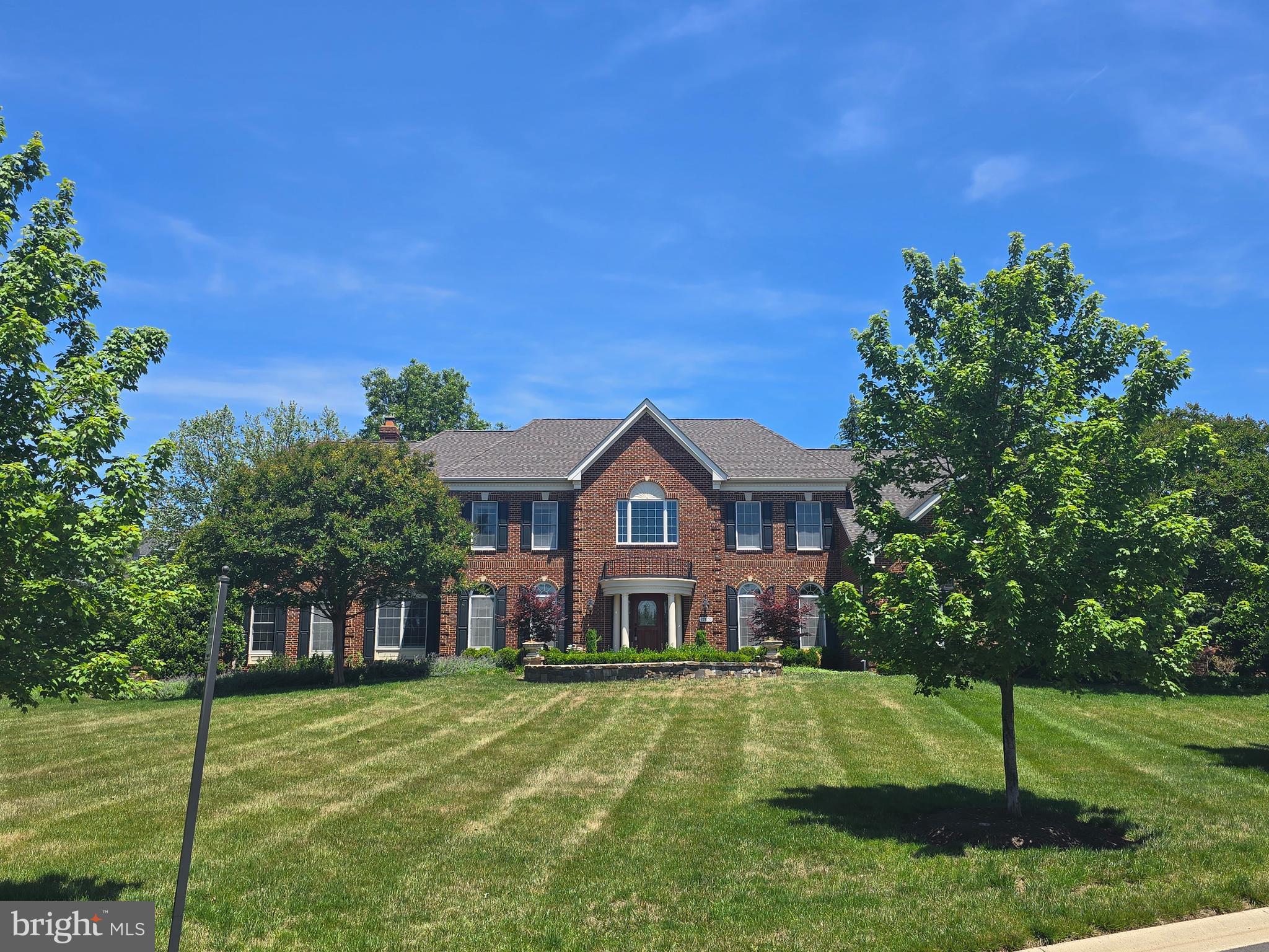 Expansive home loaded with upgrades and additions on large premium lot*Spectacular kitchen features 6 burner range with pot filler, Advantium double wall oven, stone, with cozy sunroom with gas fireplace*Large family room with slate floor and gas fireplace*Main level library with built-ins*Side conservatory with walls of windows*Dining room features custom moulding and tray ceiling with butlers pantry with wine cooler*Huge master suite with coffered ceiling, gas fireplace, large separate sitting room with television and incredible master bath with heated tile floors*Finished lower level offers huge recreation room, theater area, custom wet bar, separate exercise room, 2 full baths, separate golf simulator room and den/bedroom*Beautiful stone patio with stone outdoor fireplace and built in grilling area and so much more*