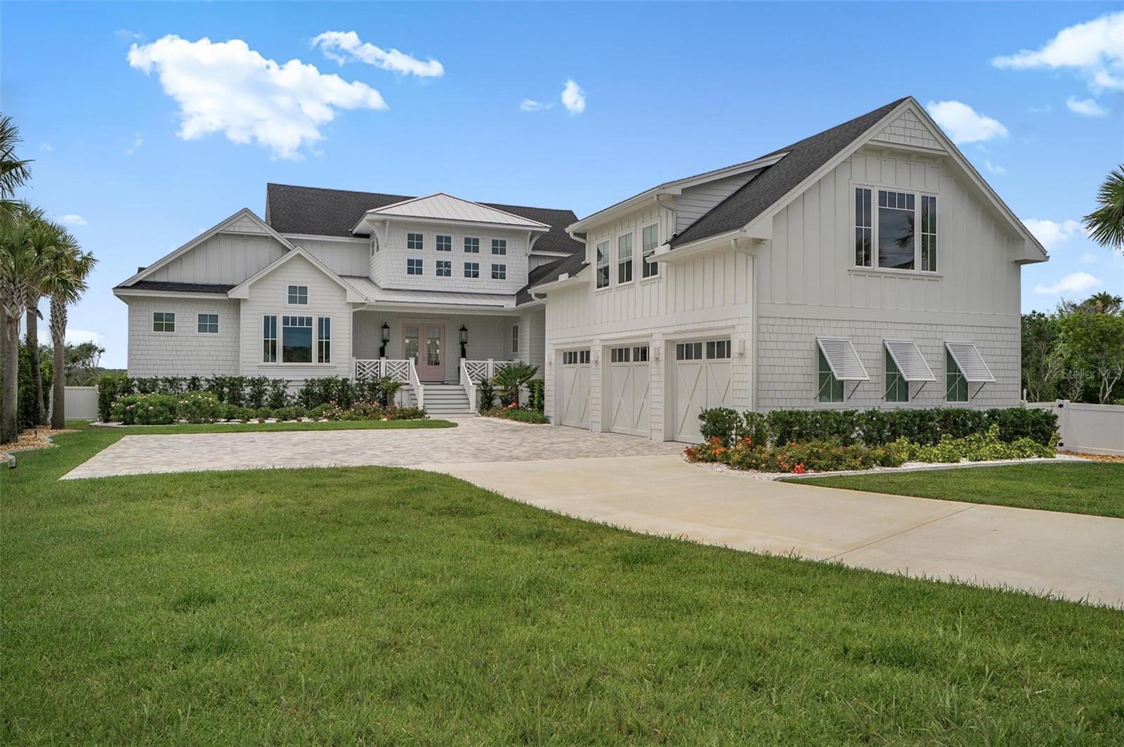 BREATHTAKING is the only way to describe this beautiful home and location.  Experience exceptional waterfront living at 8065 A1A South, a private Intracoastal estate set on more than an acre just minutes from Historic Downtown St. Augustine. Soaring ceilings, designer finishes, statement Visual Comfort lighting, and walls of glass frame breathtaking water views, spectacular sunsets, abundant birdlife, and sailboats gliding by.Designed for effortless indoor-outdoor living, the resort-inspired grounds feature a heated saltwater pool and spa, summer kitchen, pool bath, expansive lawn, and a palm-lined pickleball court with covered pavilion, all surrounded by lush tropical landscaping. The chef’s kitchen is equipped with JennAir column refrigeration, a professional-grade gas range, double ovens, an oversized island, wet bar, and a fully equipped butler’s pantry.The primary suite occupies its own secluded retreat, featuring vaulted ceilings, a waterfront lounge, a spa-inspired bath, a boutique-style dressing room, and private laundry. Beyond the suite, the property boasts a complete luxury one bedroom apartment!Built with comfort and peace of mind, the home includes impact windows, a whole-house Generac, underground sump pump system, irrigation well, and Shellock permeable pavers. Perfectly positioned in Cresent Beach, with easy access to pristine beaches, boating, fishing, kayaking, and paddleboarding, this remarkable estate blends elegant design with the natural beauty of Florida’s coast, creating an extraordinary waterfront lifestyle.
