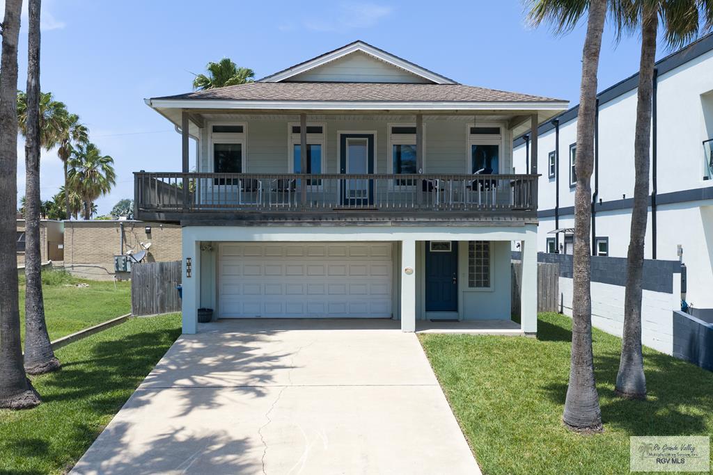 Tucked near the bay, this charming 2-bedroom, 2.5-bath coastal retreat offers 1,514 square feet of relaxed living designed for enjoying life by the water. Spend your days fishing nearby and your evenings soaking in unforgettable sunsets from the front and back half wraparound porches, perfectly positioned to catch every coastal breeze. Inside, the home features a spacious, fully furnished living area and a well-appointed kitchen with abundant cabinetry and soft-close finishes. Step outside to your private backyard oasis with a pool, covered patio, and inviting spaces ideal for entertaining or unwinding with morning coffee or afternoon cocktails. A one-car garage provides the perfect spot for your golf cart, fishing gear, and beach toys—everything you need for effortless coastal living.