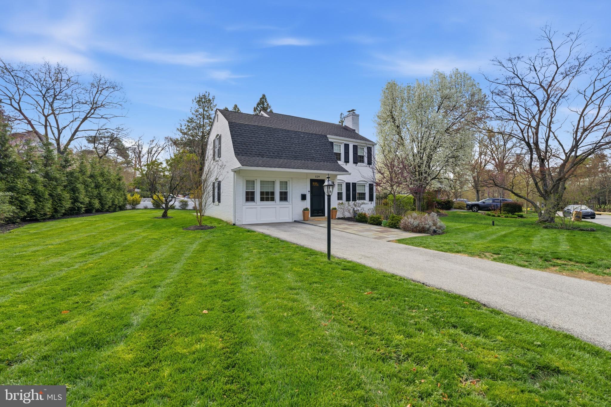 Nothing not to love!  Welcome to 529 Shortridge Dr, offering one of the best locations in Wynnewood and a complete move- in ready appeal!  The current owners have done such an incredible job updating this home, inside and out! Offering 3+ bedrooms, 2 full baths, a partially finished basement, perfect for a guest space, playroom or office and a phenomenal corner lot with lush landscaping everywhere you turn! Pull up and fall in love with the classic white brick, black shutters, flagstone walkway and flower beds and perfectly frame the home.  The foyer entry welcomes you and so do the gleaming oak hardwood floors.  The living room is nice in size with a custom mantle, tons of natural light and room for a larger sectional.  The living room leads you right into the dining room, making the flow great for hosting parties and holidays.  The kitchen has ample cabinets, granite countertops, stainless steel appliances and a door leading to the amazing EP Henry patio, fenced yard and privacy landscaping. The first floor has a bonus room that would make a great 4th bedroom since it has an attached full bath, large office, 2nd living room or guest space.  The 2nd floor is light and bright!  A nicely sized primary bedroom with walk-in closet, 2 additional bedrooms, both very nice in size and a spacious hall bath with tub.  The lower level of the home has been partially finished, offering even more living space depending on your needs.  It makes a great office, den, or playroom.  The laundry and utilities are separated for convenience.  This entire home is a breath of fresh air in every aspect.  Knowing that so much has been done already puts you at such ease!  Newer EP Henry patio, newer shed, newer vinyl fencing, fresh carpet, paint and high hats in many rooms, sump pump and French drain added, newer HVAC, custom window treatments, gas fireplace, custom closet built-ins throughout, new vinyl siding and the list goes on!  This home is perfectly appointed and has so much storage space! Larger and functional closets throughout.  The proximity to Shortridge Park is everything!  Enjoy a quick ride to Narberth, Suburban Square and Wynnewood.  Be prepared to fall in love!