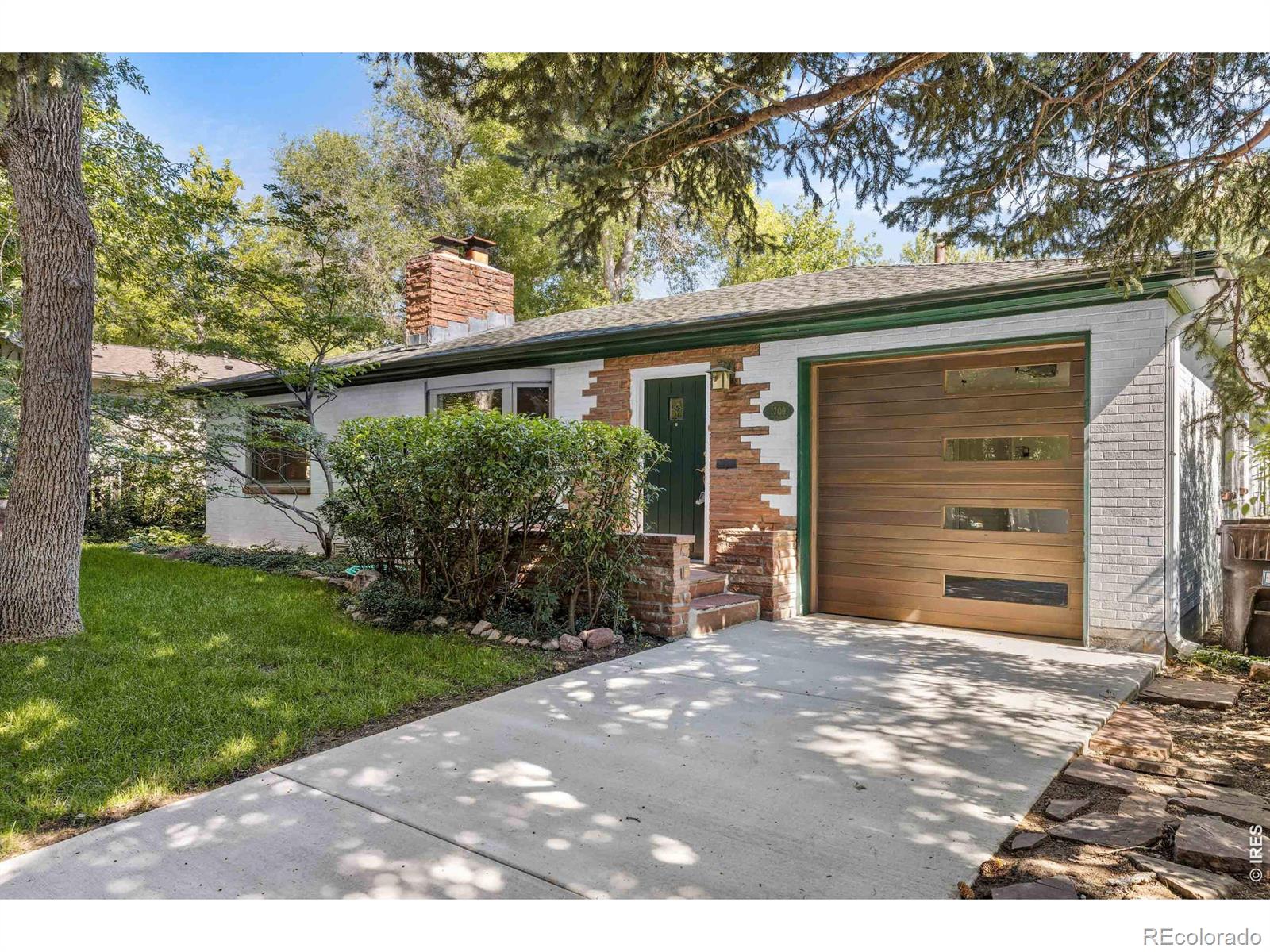 Experience the magic of one of Boulder's most beloved neighborhoods with this charming single-level home on a beautifully landscaped lot. Offering 3 bedrooms and 2 1/2 bathrooms, the thoughtful floor plan provides both comfort and privacy - the primary suite occupies its own wing with abundant windows, natural light, and direct outdoor access. The fully fenced backyard is a gardener's paradise, lush with flowering plants, mature shrubs, and a living green screen. Relax and entertain around the covered lap pool and spa or simply enjoy the peaceful sound of the seasonal ditch running along the alley. The attached one-car garage off Mariposa adds everyday convenience, while the rear of the lot features an impressive two-story accessory structure. The lower-level houses a one-car garage, 3/4 bathroom, and sauna. Upstairs, a spacious studio with French doors opening to a private balcony offers inspiring flex space - and exciting ADU potential subject to City of Boulder approval. Located steps from Chautauqua Park and miles of open trails, this property delivers the quietude of a tucked-away retreat with surprisingly easy access to Baseline Road and Highway 36 - ideal for commuters heading to Denver, DIA, and beyond.