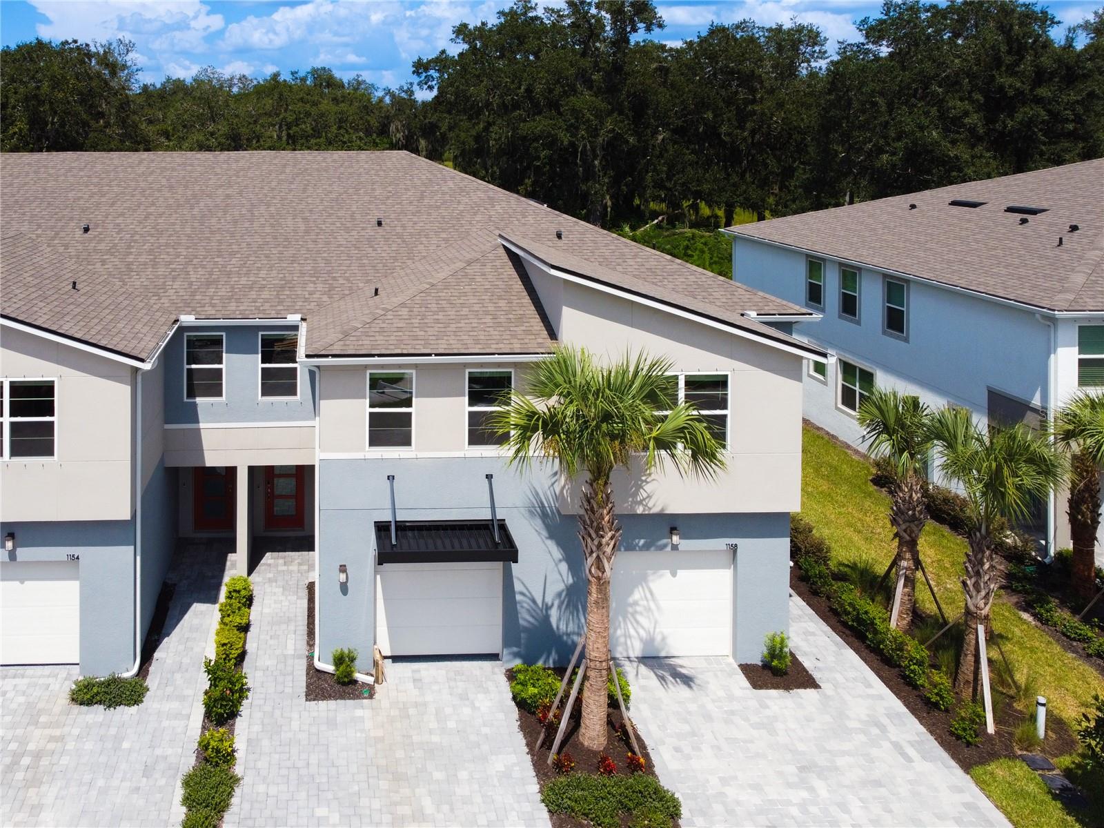NEWLY CONSTRUCTED IN 2024 • BARELY LIVED IN • END UNIT WITH ABUNDANCE OF AMBIENT LIGHT • BREATHTAKING PRESERVATION VIEW • NO REAR NEIGHBORS • $10,000 IN LUXURY UPGRADES • NO CDD!  Discover an extraordinary opportunity to own a dazzling, move-in ready masterpiece nestled inside the prestigious gated enclave of Bloomingdale Townes in highly coveted Southeast Brandon. This magnificent 3-bedroom, 2.5-bathroom end-unit townhome with a versatile loft offers 1,900 plus square feet of sophisticated, sun-drenched living space thoughtfully designed for modern luxury, ultimate privacy, and effortless entertaining. Step inside to a grand true foyer and an awe-inspiring open-concept floor plan bathed in natural light. Every detail whispers elegance, with over $10,000 in exquisite builder upgrades including:• Gleaming luxury vinyl plank flooring throughout the entire first floor--top of the line • Premium 42" PureStyle Cabinets • Luxurious Quartz Countertops • Designer upgraded finishes in kitchen and baths • Smart-home convenience for a truly connected lifestyle. WOW The heart of this showstopper home is a chef-inspired showpiece kitchen, a dream for entertaining, boasting sleek stainless-steel appliances, an oversized center island, abundant custom cabinetry, and radiant quartz surfaces with seamless sightlines to the expansive great room.  Effortlessly flow from cooking to dining to relaxing, or glide through large glass sliders to your private screened lanai finished with charming stone pavers. Beyond lies your own tranquil sanctuary: a serene PRESERVATION VIEW with NO REAR NEIGHBORS, an idyllic, private backdrop perfect for morning coffee and sunset unwinds. Sit back and read your favor book or just enjoy all the serenity and tranquility with a tropical oasis backdrop.  Ascend upstairs to a blissful owner's retreat, a private luxurious escape thoughtfully separated from secondary bedrooms. Indulge in a spa-inspired en-suite bath with dual vanities, stunning quartz counters, and an oversized walk-in shower, plus a generous walk-in closet.  This is more than a home, it is a rare lifestyle offering unmatched tranquility, timeless beauty, and prime location near top-rated schools, shopping, dining, and major highways. Do not miss this breathtaking barely-lived-in gem. Florida luxury at its finest! Upgrades galore, epoxy garage  floor and double wide driveway for 2 parked cars or vehicles. HOA fees include lawn maintenance, trash pick-up, security gate,  street lighting, and water. Gorgeous, pristine community pool with bbq. Location is Unbeatable, it's a geologic marvel on access to main highways and shopping--new Publix across the street, walk to shopping/dining/bistros/salons, top-rated Bloomingdale Schools, and quick access to Selmon, I-75, 301, Downtown Tampa & MacDill. End unit. Three close-by community parks, YMCA, Baseball Fields. Preservation view. Loaded with upgrades. Gated. No CDD. This isn’t just a townhome – it’s easy Florida living at its best. Schedule your private tour today now.