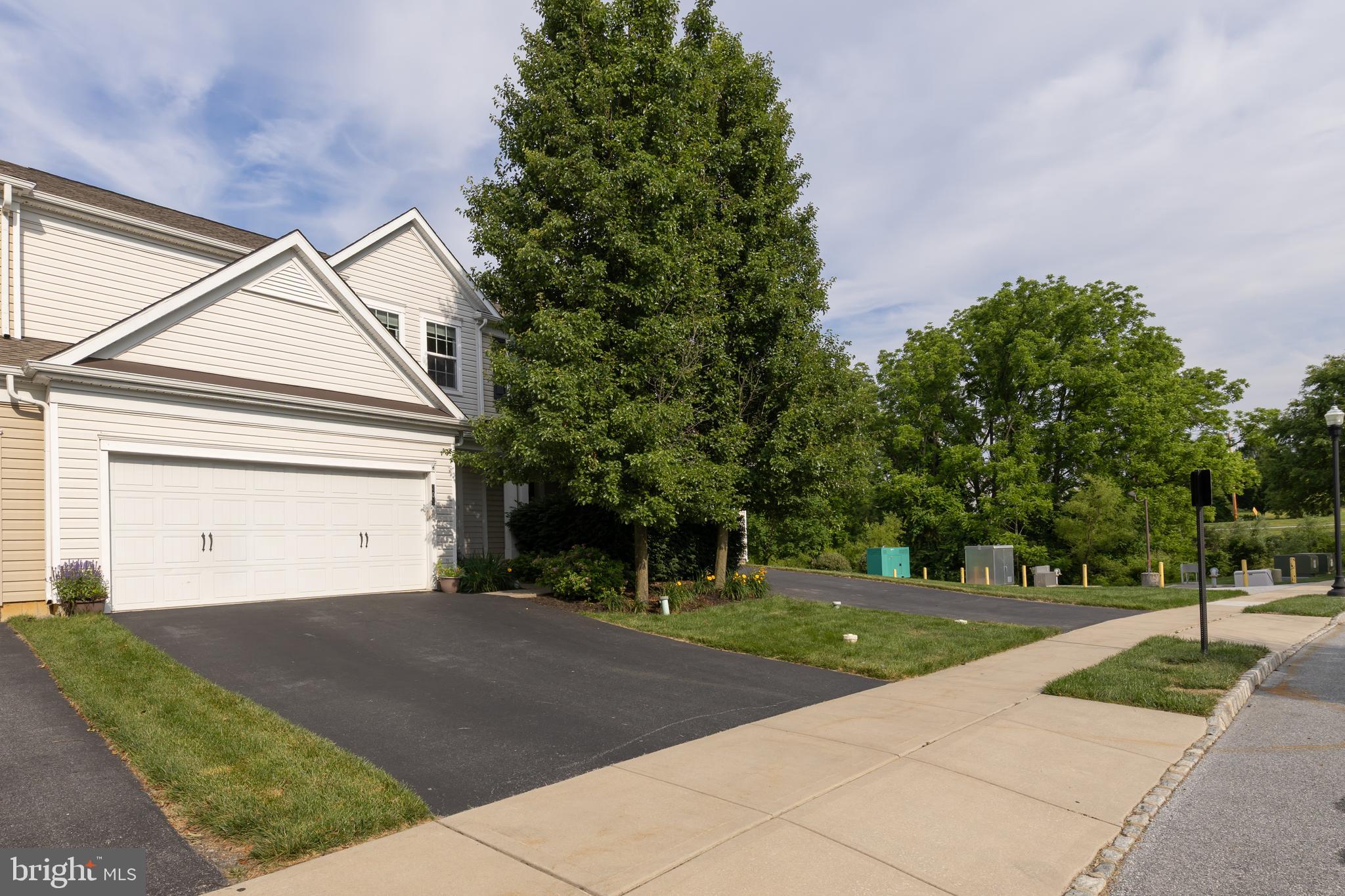 Live in the Beautiful Brandywine Valley in a spacious townhome in the rarely available Applecross Community in the award-winning Downingtown School District, including STEM Academy.  This Community gives you access to all the recreational, fitness, dining and spa amenities of the Applecross Country Club as well as 6 complimentary rounds of golf annually.  203 Sills is one of the homes with a large deck and grass field overlooking one of the many nature paths for walking, running or biking.  So much to enjoy literally in your own backyard!The home features a large 2 car garage with plenty of storage space as well as 2 additional driveway spots.  The foyer and entry hall lead to an open floor plan living room and full dining area featuring a fireplace, large windows and a double slider door leading to a spacious Trex deck overlooking the nature trails.  The kitchen is large with a bar counter opening through to the dining room and extensive counter space and cabinets.  There is also a powder room on the main floor and interior garage access.The basement is fully finished and currently used as a media and game room with a large storage area.  The upper floor features a wide hallway leading to three bedrooms a hall bath and full laundry room.  The primary bedroom has a large ensuite bath with expansive double vanity and a walk-in closet.  This house gives you all the space you need, an easy lifestyle and great amenities.  Spend your time enjoying the indoor and outdoor pools, tennis courts, golf course or spa while your lawn and garden is beautifully maintained for you!