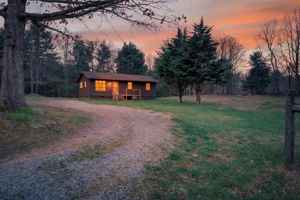BACK ON THE MARKET AT NO FAULT OF THE SELLER. Escape to your own private hideaway with this charming 3-bedroom, 1-bath cottage set on 1 acre in the countryside of Chilhowie, VA.  Surrounded by nature and set back for privacy, this home offers a comforting sense of calm from the moment you arrive. Inside, you'll find warm, inviting living spaces filled with natural light and character—perfect for relaxing, entertaining, or simply enjoying the quiet pace of rural living. Every room feels thoughtfully designed, creating a welcoming environment that instantly feels like home. Outside, the land provides plenty of room to garden, explore, or unwind in your own private retreat. A standout feature is the two-story outbuilding located out back, offering excellent potential for storage, hobbies, or a future creative workspace.  If you're searching for peace, seclusion, and the timeless charm of country living, this Chilhowie cottage delivers it beautifully.