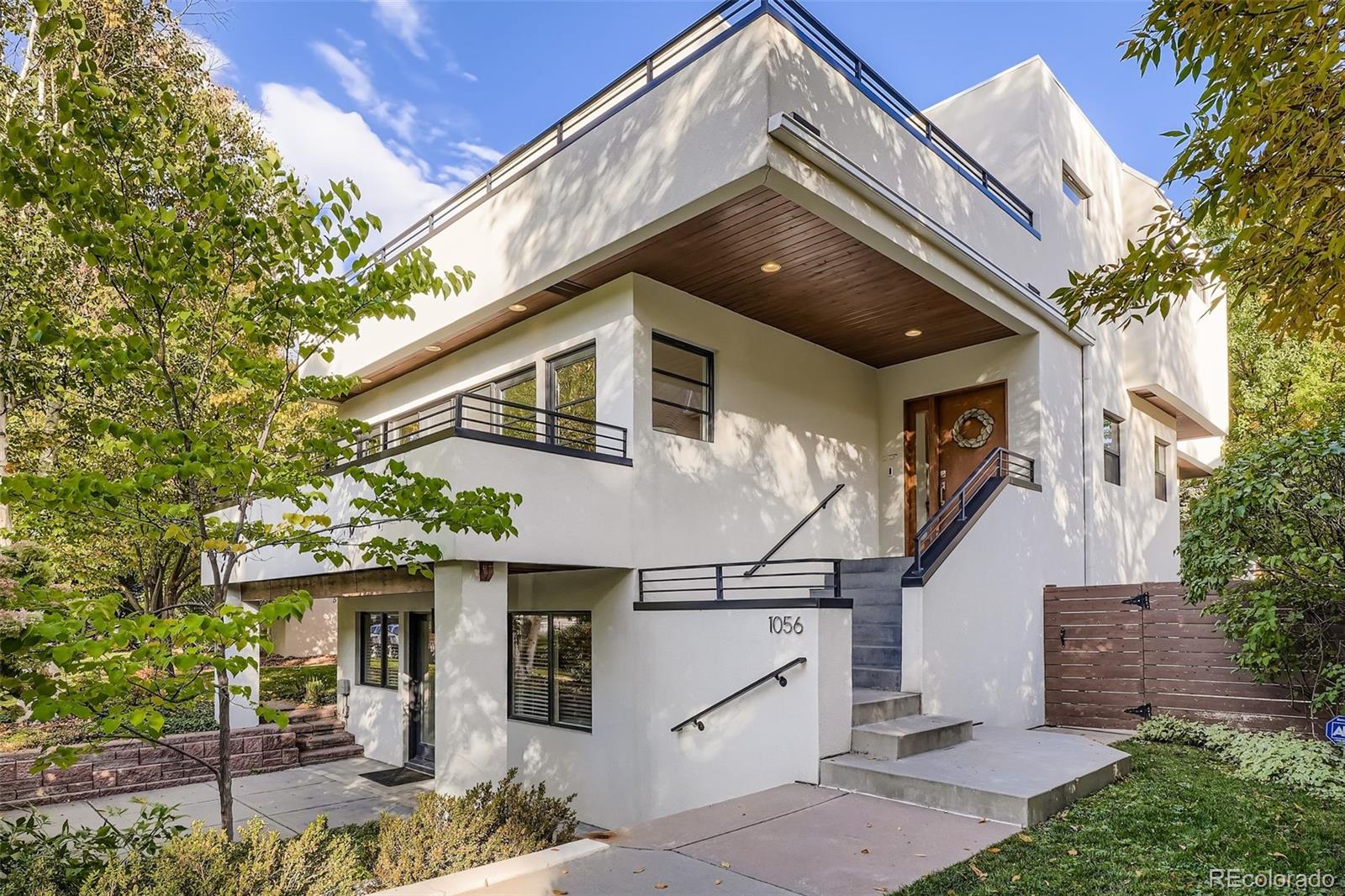 Located in the highly sought after Bonnie Brae neighborhood on one of the best blocks, this gorgeous home is on trend and fresh with the 1930's International Style that is prevalent in the neighborhood.  This beautiful home features 5 bedrooms (1 main / 3 upper / 1 bsmt-conforming), 3.5 baths, living room, dining room, upper laundry, a rare, finished WALKOUT basement (family / rec room, bath, bedroom, office, utility/mechanical room) and detached 2 car garage. Original details like built-ins are blended seamlessly with modern updates to make this home inviting & comfortable. The many windows and skylights allow the natural light to cascade in – bright and cheerful.  So many thoughtful touches abound in this great property – this one a must see.  The two Mitsubishi splits (living and master) are both AC and heat - ensuring year round comfort. Enjoy relaxing on the covered deck and patio or soak in the views from the private balconies. All 4 televisions, washer and dryer are included. This gorgeous home sits up higher that most with mature landscaping  which offers ample privacy and great views.  No HOA.Close to dining, shopping, entertainment and other amenities.  Don’t miss your opportunity to own this unique and beautiful property. Welcome Home!