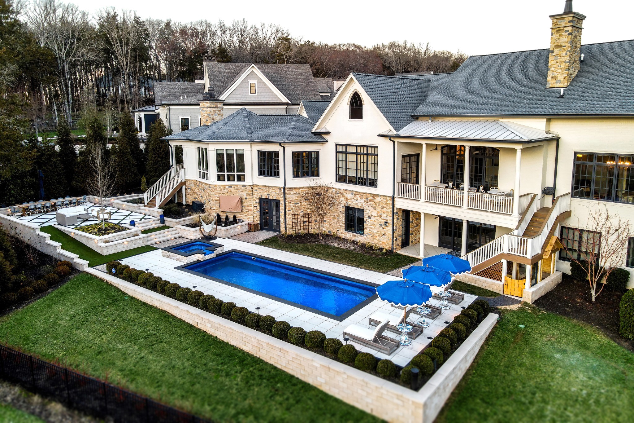 This house was made for memory-making!  New pool, new roof, new 2000 ft addition.  Includes a private backyard with huge vistas overlooking the Greg Norman-designed golf course, several ponds, and 30+ undisturbed acres with views of the beautiful Tennessee hills. Home includes many built-ins, a game room that leads to the pool, a sunroom that leads to an outdoor covered grill area, a gym, geothermal heating, large storage areas, private outdoor spaces, a child's outdoor under-the-stairs playhouse, oversized garages, electric shades. Three gas fireplaces. The fabulous pool, complete with a great view of the outside TV, is perfect for family fun, and the equipment is housed inside for easy maintenance ~  This dreamy 6-bedroom, 6-bath home has been immaculately maintained and thoughtfully designed. TWO bedrooms on the MAIN floor. No detail was overlooked. Wonderful plan for a multi-generational home. Private entrance for the downstairs area. Perfect for an in-law or a college student. Too many extras to list. This is a must-see.  You will have the perfect view from your private balcony for The Grove 4th of July fireworks!~ Constructed by award-winning Hatcliff Construction/Design. The Grove amenities include: golf, fine and casual dining, spa, fitness, outdoor pools, tennis courts, and an equestrian program. You won't want to leave~  Golf or Sports Membership is required with deposit.