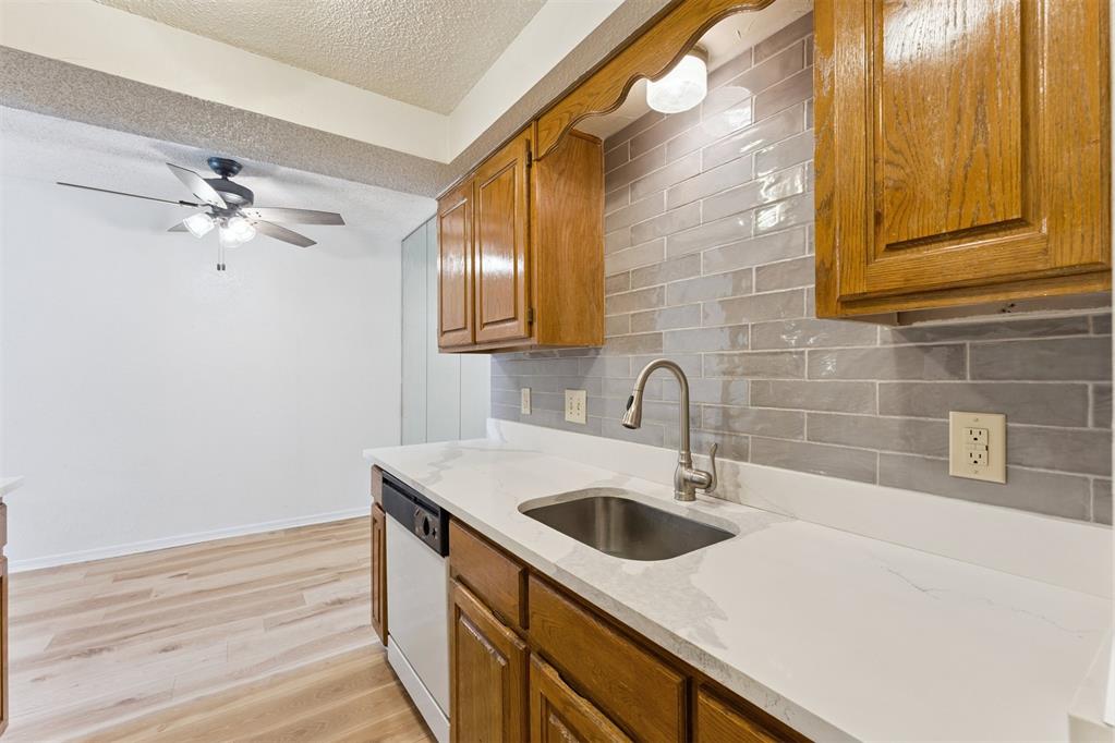 Welcome home to this beautifully updated 1-bedroom, 1-bath ground-floor condo ideally located just steps from the community pool and mailboxes for ultimate convenience. Inside, you’ll find luxury vinyl flooring throughout, fresh white walls, and modern upgrades that make this home truly move-in ready.The kitchen features quartz countertops, a subway tile backsplash, updated fixtures, new garbage disposal, and a clean, contemporary feel. The bathroom boasts a stunning quartzite countertop, and new ceiling fans add comfort and style throughout.Major systems have been taken care of with an HVAC system less than 3 years old. Refrigerator, washer, and dryer may remain with the property and are to be sold AS IS.Low-maintenance living in a prime location — perfect for a primary residence or investment opportunity. Seller is a licensed realtor in the state of Oklahoma.