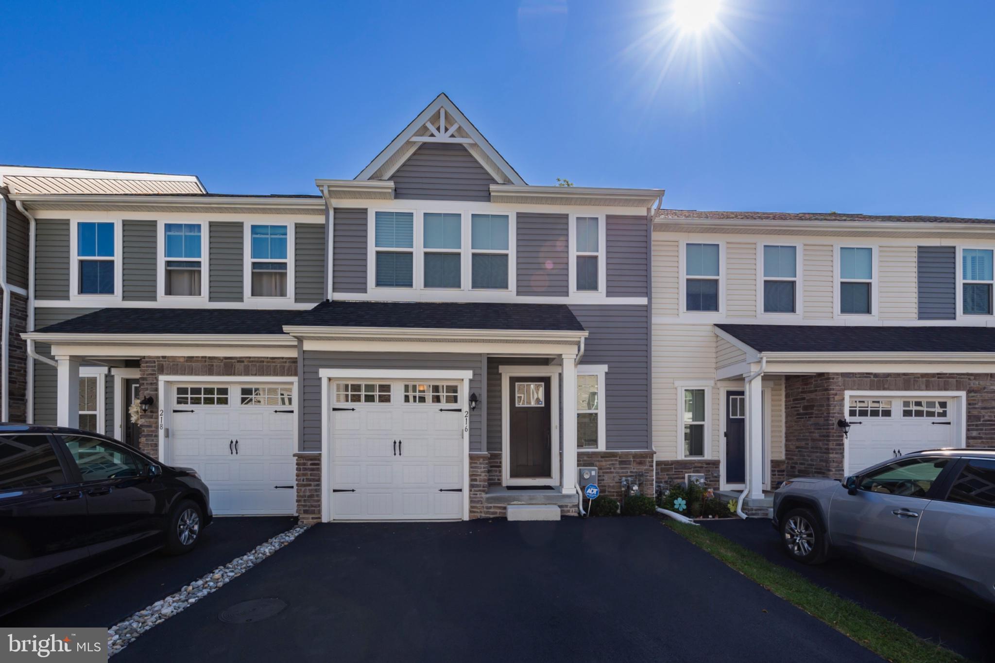 Welcome home to modern living in the heart of Downingtown.  Not your average townhome—this one is a must see and feels brand new. This stunning 3-bedroom, 3.5-bath home offers approximately 2,400 square feet of beautifully finished living space, modern finishes, an open floor plan, and an unbeatable Downingtown location.  Situated in the Downingtown School District and just a short walk to parks, schools, shopping, and restaurants, this home perfectly blends style, convenience, and everyday living.  Step inside to an inviting, light-filled main level featuring natural light, recessed lighting, and beautiful engineered wood plank flooring that continues throughout the main living areas and upstairs. The open-concept design makes entertaining and everyday living effortless.  At the heart of the home is the gorgeous gourmet kitchen, featuring  white cabinetry, an oversized island, elegant quartz countertops, and stainless steel appliances. The kitchen flows seamlessly into the spacious dining area and family room, creating the perfect gathering space. Step through the slider onto the Trex deck, where you can relax or entertain while overlooking the private yard space.  Upstairs, retreat to the spacious owner’s suite, complete with a tray ceiling and luxurious en-suite bath featuring dual sinks and quartz countertops. Two additional bedrooms, a full hall bath, and a conveniently located laundry area complete the second floor.The finished lower level adds even more flexible living space and includes its own full bath—perfect for a home office, playroom, media room, exercise space, or guest area. Plenty of closet space provides excellent storage, and the attached one-car garage adds everyday convenience.  With its modern finishes, thoughtful layout, private outdoor space, finished lower level, and walkable location, this exceptional townhome offers the best of low-maintenance, modern living in Downingtown.  Don't miss your opportunity to make this beautiful home yours!