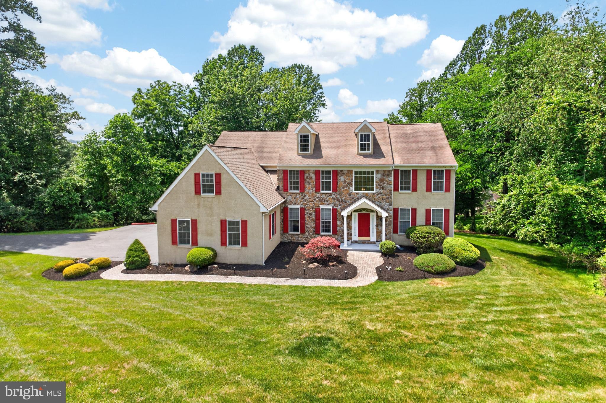 Located in the Uwchlan Hunt Communtiy, this grand 4 Bedroom and 4.5 Bath house with over 5,200 sf of finished living space is the perfect venue to host large gatherings of family and friends or find a private space to relax.   The main floor offers a two-story Foyer, open Kitchen and Family Room area with separate Dining Room with crown and chair rail molding, Living Room with crown molding, spacious Office and Laundry Room.   Plus, access to a second story Deck.  The Second Level, which is accessed by a front or rear staircase, offers a spacious Primary Bedroom with tray ceiling and a large, separate Sitting Room and Primary Bath that offers a jetted tub and separate shower.  Bedrooms 2 & 3 share a Jack & Jill Bathroom and Bedroom 4 has access to the Hall Full Bath.   The Finished Walkout, Daylight Basement offers a great, welcoming space to entertain large groups of family and friends and features a Full Bath, a very large Wet Bar, Media/Entertainment Area and lots of natural light from a French door and several windows that access a large rear Paver Patio.  The lot is 1.24 acres, slightly sloped with a large flat area to the left of the driveway for a convenient play area.  Additionally, there is a whole house generator. A summary of some of the features and amenities of this home include:  Primary Bedroom with tray ceiling; Jack & Jill Bathroom; 3/4" hardwood floors throughout most of the main living area; granite Kitchen counters; kitchen Island; crown and chair rail molding; Family Room with vaulted ceiling and a stone, floor to ceiling propane gas fireplace; spacious corner Office; separate Laundry Room off the kitchen area; two staircases to the second floor; second level hallway that overlooks the Family Room; 3 Car Side Entry Garage;  Deck access from Eat In Kitchen;  Paver Patio access from Walkout Basement.  Whole house generator.  This home offers lots of space to entertain or find a quiet space to relax.