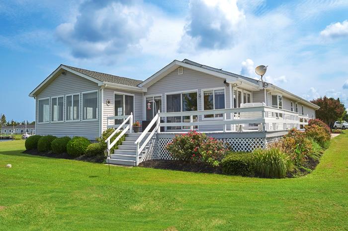 **Location, Location, Location!** This amazing waterfront home offers panoramic bay views and stunning sunset events each night from your private deck. Enjoy easy access to Chesapeake Bay with a launch boat ramp just around the corner, and keep your boat in your deep-water backyard. This spacious residence features three bedrooms, four bathrooms, an office, a dining room, a living room, and an eat-in kitchen, all highlighted by an enormous 22x22 great room. Well-maintained, this home boasts over 150 feet of new bulkheading (7YO), making it perfect for waterfront living. Life is wonderful in the popular seaside Schooner Bay community, located just 10 minutes from downtown Onancock, where you can find restaurants, shops, and theaters. 20 Minutes to Riverside hospital and medical offices.