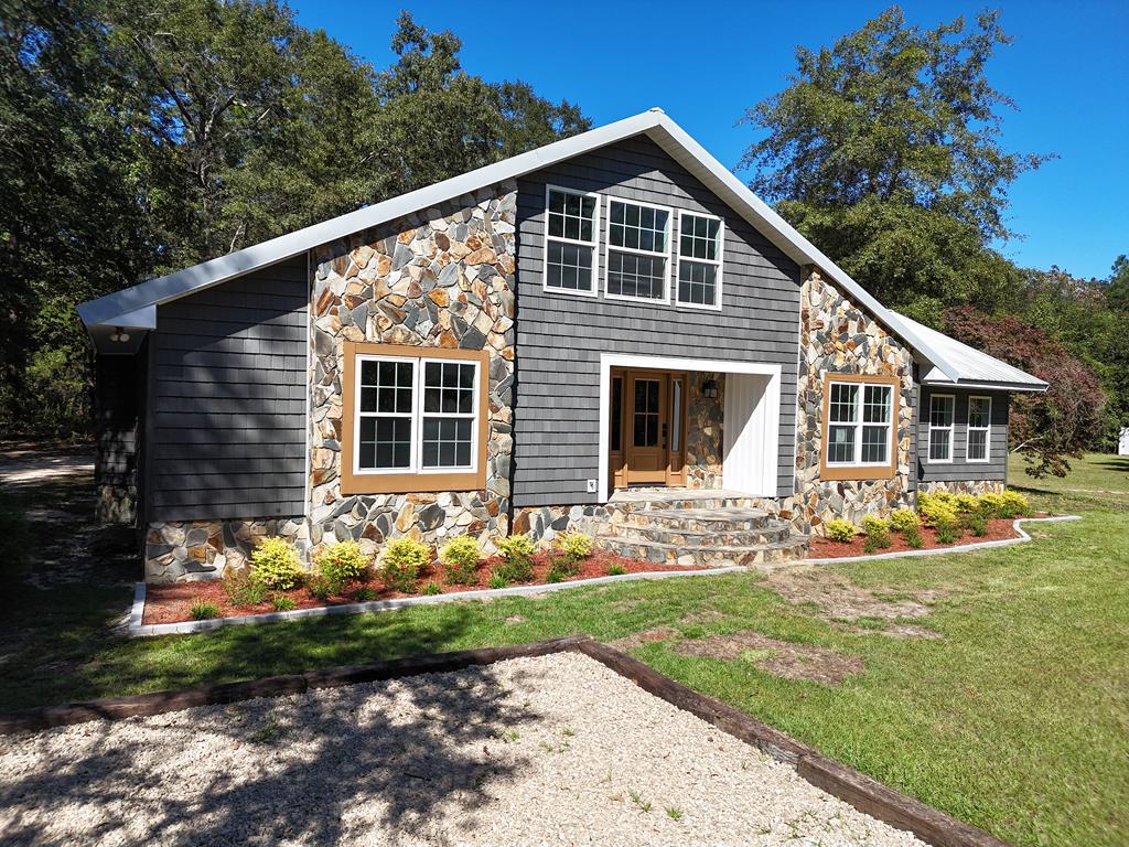 Spacious house for a growing family or entertaining. This 2700 sqfthome has 4 bedrooms and two large baths. Open floor plan combinesthe space of the kitchen dining and living areas while separatingthe bedrooms for privacy. The vaulted ceilingand windows make it light and airy. A large stoneworkfireplace and stoneworkentryway give a warm feeling upon entering. The master has built-ins, a walk-in closet and a spacious bathroom with large shower and freestanding tub. 1.79 acres and a pond gives the owner a getaway while at home. A very large side yard to expansion, perhaps a pool, or plenty of room for children to play. Behind the main house is a large workshop ready to be filled with projects. This house has everything for a forever home.