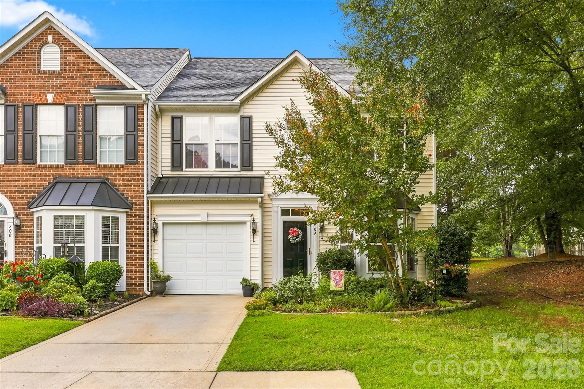 EXPERIENCE AFFORDABLE LUXURY IN THIS QUIET END-UNIT ON LAKE WYLIE! Over 1,100 SQ FT on the main level features a 2-STORY GREAT ROOM with natural light, dining area, eat-in kitchen, half bath & laundry. Relax in the 13'x15' MASTER ON THE MAIN with ensuite bath & walk-in closet! Perfect for pet lovers, enjoy a green space side yard & NO DOG BREED OR SIZE RESTRICTIONS. Upstairs, find 2 large bedrooms, a full bath, a 21'x12' LOFT & MASSIVE STORAGE, rare for townhomes. Stroll the LAKESIDE BOARDWALK, relax at the COMMUNITY POOL WITH CABANA & beach views, or enjoy the PROPERTY'S BEACH. MARINA STORAGE & BOAT DOCKING AVAILABLE! HOA COVERS GARBAGE & ALL EXTERIOR MAINTENANCE.