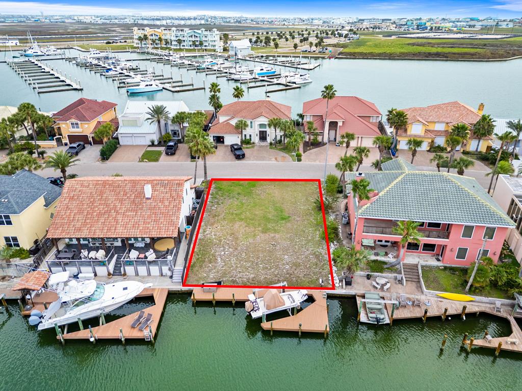 Build your dream waterfront luxury retreat in the premier canal community of Island Moorings in Port Aransas. This spacious homesite offers approx. 62 feet of canal frontage and includes electric and water infrastructure, plus a private boat dock and lift&mdash;ideal for boating and fishing enthusiasts. Enjoy easy access by water to Island Moorings Marina, Piper Channel, the flats, the ship channel, and the Gulf of Mexico. Conveniently located adjacent to the marina and just minutes from the local airport, this property blends accessibility with relaxed coastal living. By land, golf carts may cross Hwy. 361 at Access Road 1-A, providing quick access to the beach, local shops, restaurants, and Port Aransas entertainment. A rare opportunity to create a custom waterfront home in one of Port A's most desirable canal-front communities and have a good day in Port A!