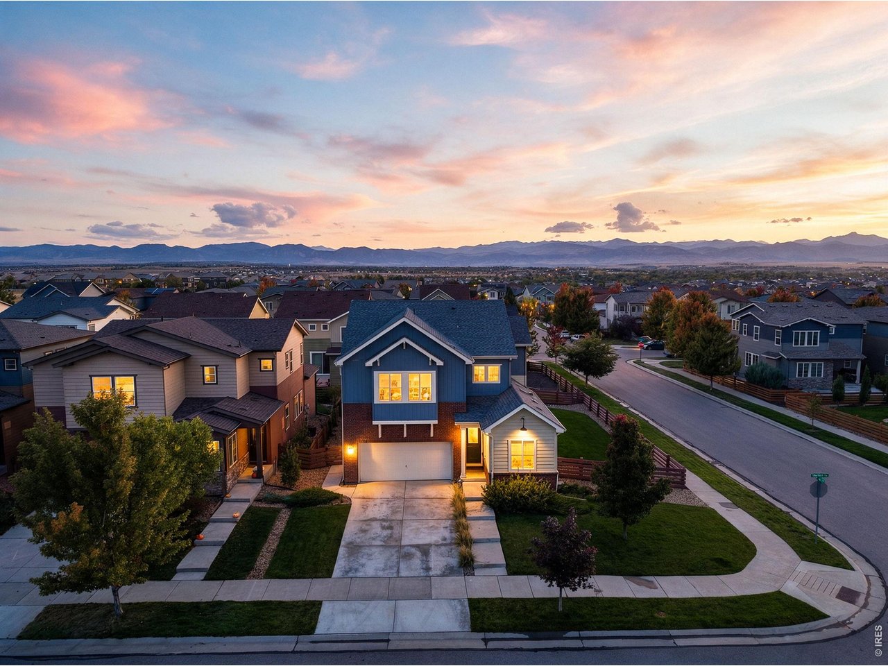 Style, function, & flexibility come together in this well-maintained Colliers Hill home, with room for everything from daily routines to entertaining a crowd. Come in through the inviting foyer or kick off your shoes in the mudroom off the garage. The main level opens to a bright, open kitchen/dining/living area that makes gathering easy. The kitchen is ready for everything from weeknight dinners to holiday spreads, with quartz countertops, gas cooktop, double ovens, large island, & a generous pantry just off the dining area. The living room's cozy fireplace invites you to settle in, while the large, stamped concrete patio off the kitchen offers plenty of space to gather, relax, & enjoy the outdoors. The corner lot adds even more outdoor space, with artificial turf for easy upkeep & a roomy side yard ready for a game of catch, soccer, or simply burning off some energy. A main-floor bedroom or office + 3/4 bath round out this level. Upstairs, the primary suite offers a lovely retreat, complete with an en suite bath featuring a large shower, double sinks, plenty of counter space & storage + a walk-in closet. Two additional bedrooms, a full bath, a generous loft, & upstairs laundry room keep daily life running smoothly. Need more room? The full, finished basement delivers. There's a tinkering room for projects, a media or rec area for movie nights & game days + an additional space that could be enclosed as a 5th bedroom or put to work as a playroom, gym or whatever else life calls for. New class 4 roof installed in 2025. Set in Colliers Hill, the home offers convenient access to community pools, parks, & miles of trails. Old Town Erie is just minutes away, with great restaurants, a farmers market, shopping & more. Boulder, Denver, Fort Collins & Denver International Airport are also within easy reach. With flexible spaces, quality finishes, a low-maintenance yard + room to spread out, come together, this home makes a pretty compelling case for staying awhile.