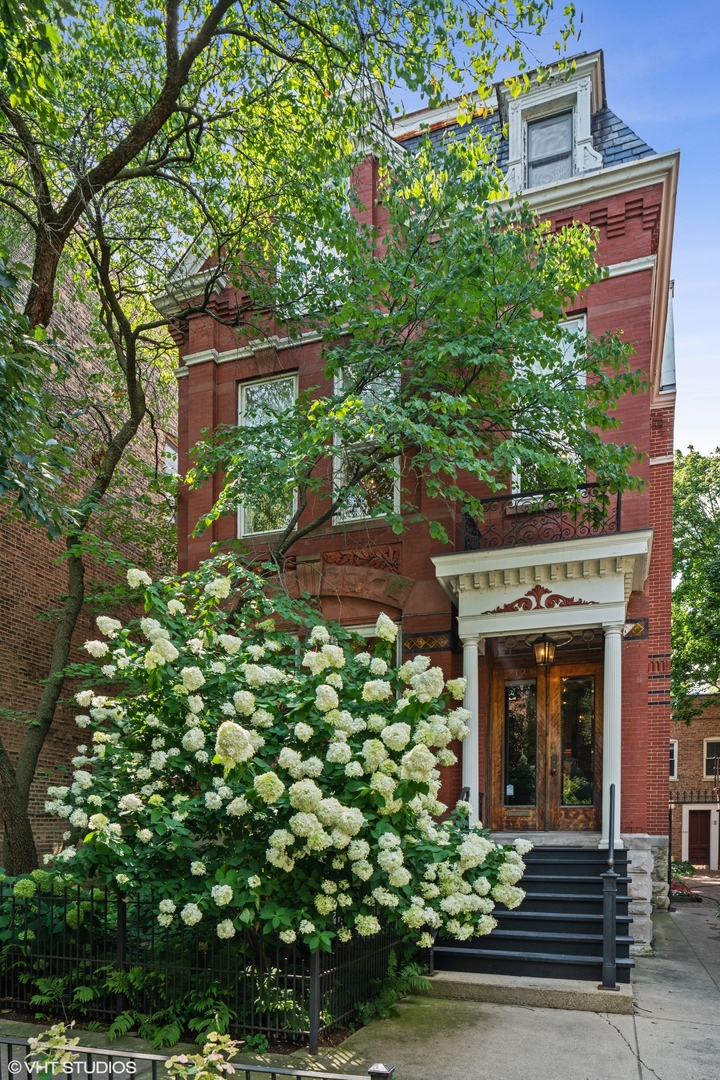 Welcome to 2124 N Cleveland Avenue, an awe-inspiring Victorian masterpiece nestled in the coveted heart of Lincoln Park, situated on an oversized lot in Chicago's premier neighborhood. Just steps from Oz Park this exceptional 6-bedroom, 4.2-bathroom estate beautifully marries historic grandeur with sophisticated modern luxury. From the moment you step inside, you're in a world of timeless elegance, with original stained-glass windows, meticulously restored pocket doors, ornate crown molding, and soaring 12-foot ceilings, all contributing to the home's unparalleled charm. The grand foyer sets the tone, with double doors, a striking curved staircase, and an arched entryway leading to a light-filled, stately living room. The family room, anchored by a cozy log-burning fireplace and custom-built shelving, invites both comfort and conversation, while gleaming oak hardwood floors stretch throughout. The gourmet kitchen is a chef's dream-boasting top-of-the-line stainless steel appliances, abundant storage, and a spacious dine-in area with a bespoke banquette. Complete with a built-in sound system, this culinary haven seamlessly connects to the adjacent sitting rooms, making it the ultimate setting for entertaining. On the second level, the primary suite offers a serene retreat, while two additional bedrooms and a dedicated office or study complete the floor plan. The third level is equally impressive, with three more generously sized bedrooms, a Jack-and-Jill bath, another office, a family room, and additional conveniently located laundry room on the top-- this area could easily be turned into separate living quarters with ensuite bathroom and back staircase entrance. The expansive lower level is the epitome of functionality and comfort, featuring a media room, mudroom with direct back yard entrance located close to the garage, a large laundry/utility room, extra storage, bathroom, and a bonus room for whatever your heart desires. Step outside to the enchanting deck and patio area, where a charming pergola and ample seating create a perfect outdoor oasis for relaxation or hosting gatherings. The detached two-car garage with coach house potential offers additional space for convenience and versatility. Don't miss your chance to make this architectural gem your own!    2023 taxes were reduced in mid 2024 to $63,812.38. The 2024 taxes will be reduced further, by $11,678, resulting in $52,134.38 for the year