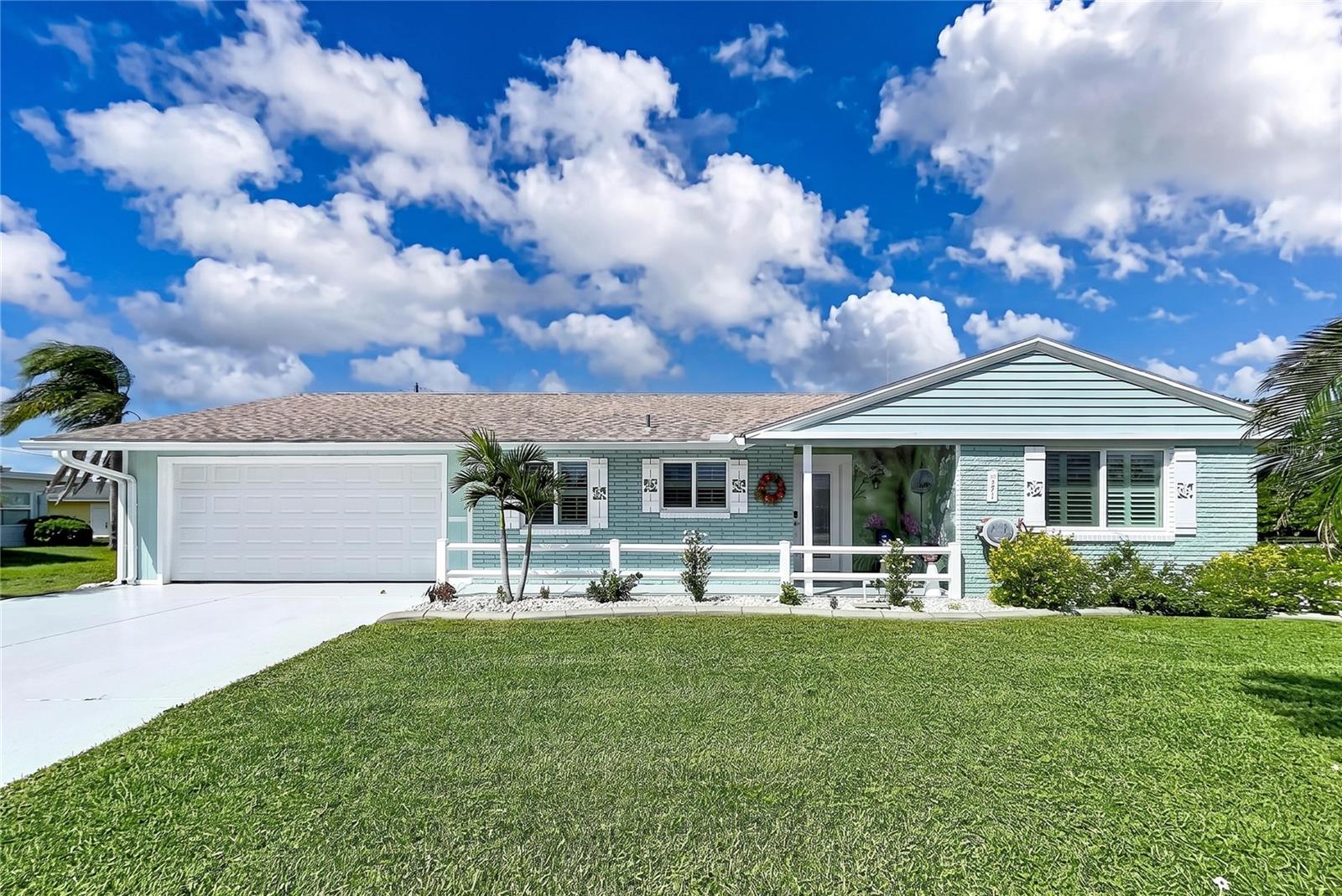 WELCOME TO PARADISE! COMFORTABLE FLORIDA LIVING WITH STYLE, METICULOUS UPDATES, AND NO HOA!Located on the desirable north side of Sun City Center, this well-maintained home offers an inviting blend of modern updates, functional living space, and affordability. Attractive landscaping and welcoming curb appeal lead you inside to a bright, spacious foyer and a fresh interior featuring light gray tones and luxury vinyl flooring throughout, creating a cohesive look from room to room.Both bathrooms have been updated, and the home features fresh interior paint, updated fixtures, and ceiling fans. Additional recessed lighting in the family room and primary bedroom enhances visibility and comfort. A newer roof (2021) and hurricane-impact windows provide added peace of mind.The thoughtfully designed galley kitchen is bright and airy, featuring light cabinetry, a built-in desk, solid-surface countertops, and stainless-steel appliances for a modern look.The primary suite offers a walk-in closet. Just beyond the garage, you'll find a convenient laundry room with additional storage. The garage floor has also been recently finished with an epoxy coating.Outdoor living is equally inviting, with a brand-new covered, screened lanai overlooking the beautifully landscaped, fenced backyard. Enjoy peaceful surroundings and an open patio perfect for grilling, sunbathing, or soaking up the Florida sunshine.Enjoy the Sun City Center lifestyle with convenient access to shopping, dining, medical services, beaches, airports, and entertainment. This established 55+ community offers a wealth of recreational and social opportunities, including indoor and outdoor pools, fitness facilities, golf, pickleball, lawn bowling, arts and crafts, clubs, and activities. Many destinations are accessible by golf cart, adding to the convenience of everyday living.With its desirable location, recent updates, versatile living spaces, and NO HOA, this home is an inviting opportunity to enjoy the best of Florida living!