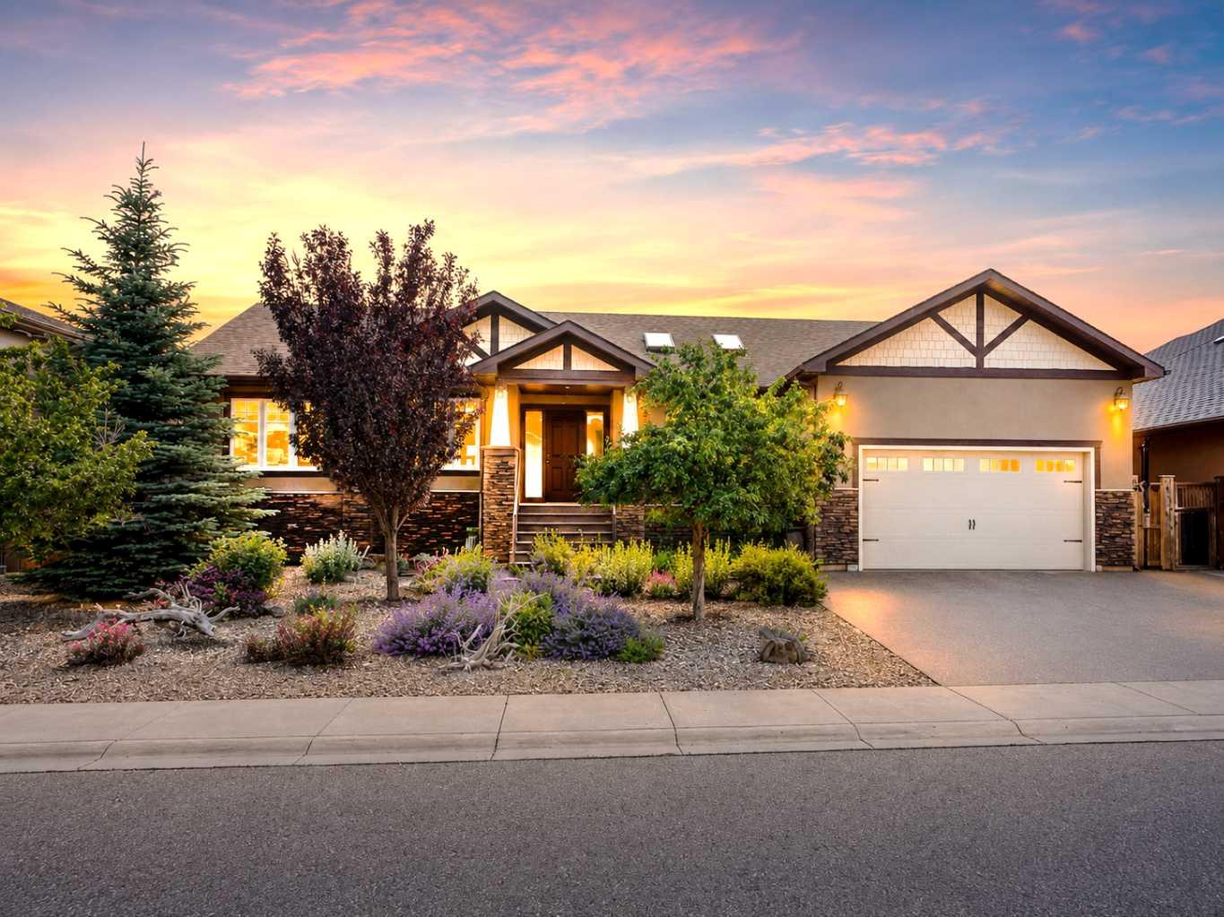 Discover luxury living in the exclusive community of Paradise Pointe with this exceptional craftsman-style bungalow backing directly onto the coulees of Paradise Canyon. Situated on a beautifully landscaped and fenced 79’ x 123’ lot, this executive home offers over 3,300 sq. ft. of fully developed living space designed for upscale comfort and entertaining.The bright open-concept main floor is filled with natural light and showcases premium finishes throughout, including granite countertops, a custom birchwood kitchen, and rich knotty alder doors and trim. With 5 bedrooms and 3 bathrooms, and room to spare, this home offers flexibility for families, professionals, and guests alike.The fully developed basement features a massive recreation room, wet bar, and additional entertaining space, while the large deck and patio overlook the stunning coulee landscape. Additional highlights include an oversized double attached garage, integrated solar panel system, built in home stereo system, and a prestigious west Lethbridge location near Paradise Canyon Golf Resort.A rare luxury bungalow offering privacy, craftsmanship, and breathtaking natural surroundings in one of Lethbridge’s most sought-after neighbourhoods all for under the appraised value.