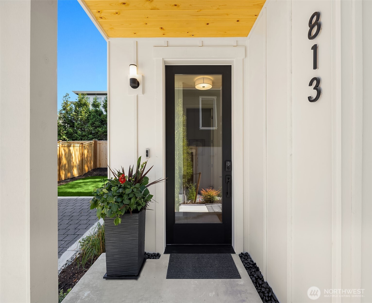 Welcome to this new construction cottage in coveted West of Market by DKWozniak Design Build. Light-filled main level features open kitchen, dining, and living with fireplace and sliders to a covered patio and fenced yard—perfect for indoor/outdoor living. Kitchen shines with gas range and quartz counters. Upstairs offers a serene primary suite with luxurious bath & WIC. Secondary bedroom includes walk in closet. Full bath and laundry complete this thoughtfully-appointed home. Enjoy proximity to Lake Washington, Waverly Beach Park, and downtown Kirkland. Off-street parking provides peace of mind at the end of the day.