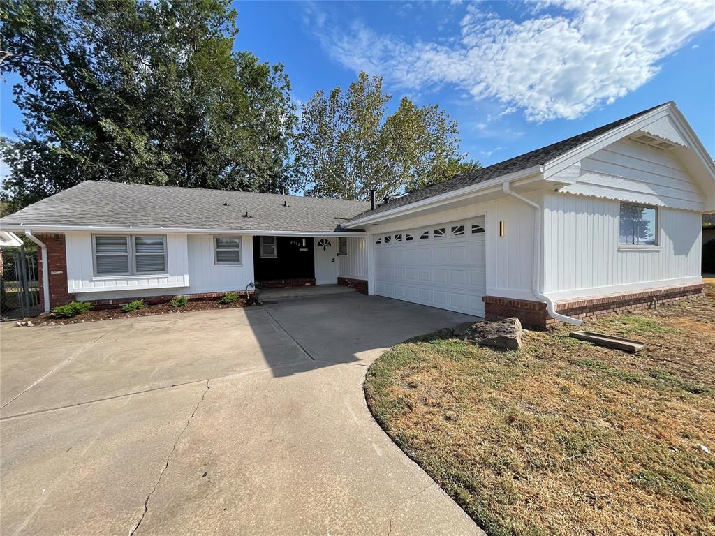 Step inside this beautifully updated home featuring a spacious, open-concept layout designed for comfortable living and entertaining. The inviting living and dining areas flow seamlessly into a modern kitchen, creating a bright and welcoming space with plenty of room to gather. The kitchen features white cabinetry, sleek dark countertops, stainless-steel appliances, a large center island with additional storage, and stylish pendant lighting. Newer-looking luxury vinyl plank flooring extends throughout the main living areas, complemented by neutral gray walls and abundant recessed lighting. Large windows and sliding glass doors bring in plenty of natural light, while the generous open floor plan provides flexibility for a dining area, family room, or additional seating. The clean, contemporary finishes give the home a fresh, move-in-ready feel. An underground tornado shelter located in the garage for your safety.A wonderful opportunity for anyone looking for a fresh, modern home with an inviting layout and stylish updates.