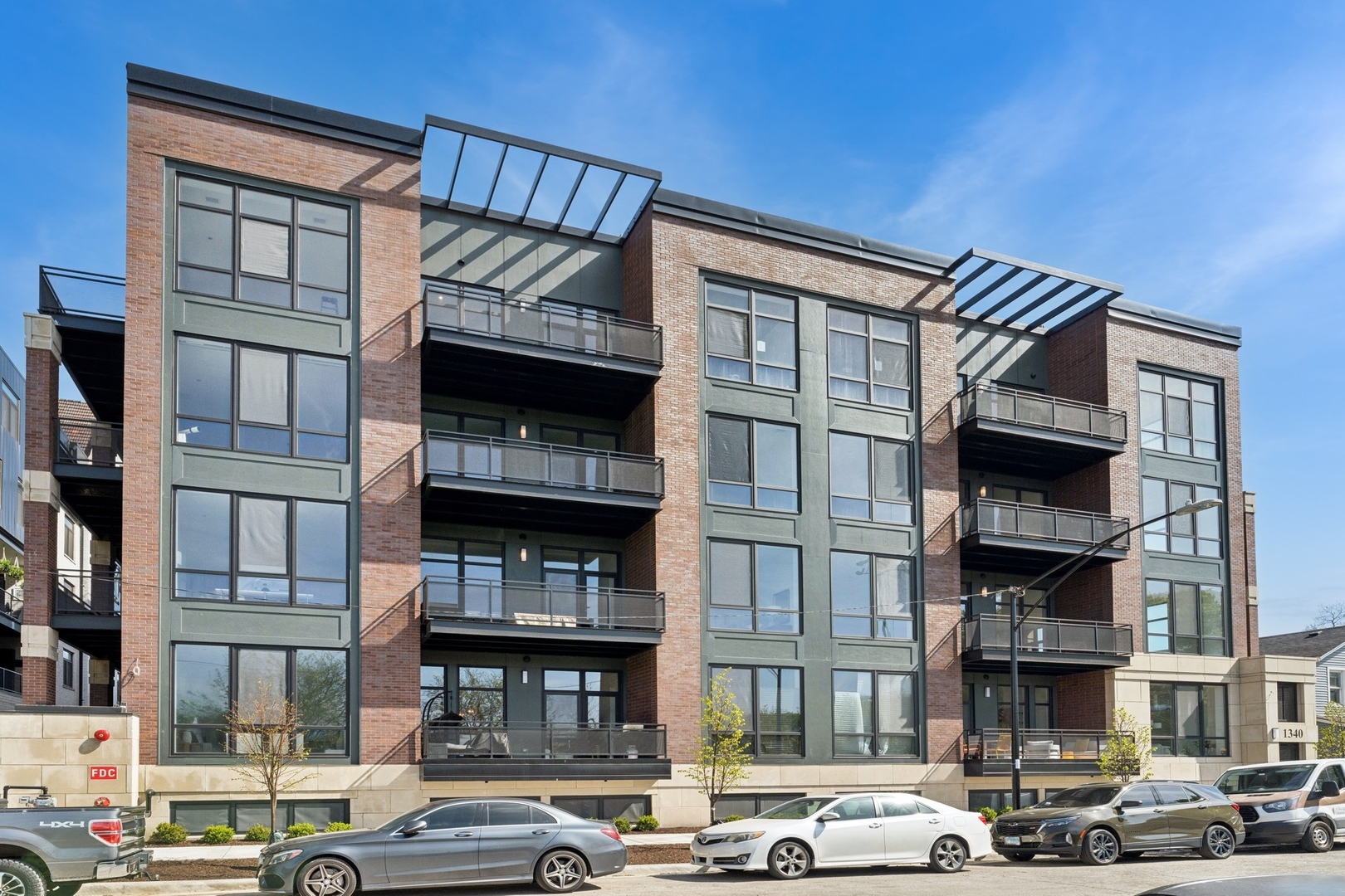 MOVE-N READY NEW CONSTRUCTION -- Residence 204 is an oversized duplex condo facing Eckhart Park and the Chicago skyline in Noble Square's newest development at 1340 W Chestnut. With 4 Suites + Family Room + Private Office, this private endcap condo lives like a single-family home, with room for everyone day and night. The Living/Dining/Kitchen is filled with natural south light. Enjoy views of Eckhart Park and St Boniface next door. Brand new, light wood floors run throughout the home on both levels and all bedrooms. The large, all-white, high-end kitchen features shaker front cabinetry, quartz countertops, full-height backsplash, and new, integrated Bosch and Thermador appliances including a French door refrigerator and externally-vented kitchen hood. A separate pantry closet provides additional storage for appliances and snacks. The living space overflows into a private 174 SF balcony facing St Boniface, perfect for grilling and entertaining. The main level delivers a spacious Family Room, private Primary Suite, and two additional suites. The Primary Suite includes a massive 6ft x 13ft Dressing Room and Primary Bathroom features double bowl vanity and glass shower. A huge, private walkout terrace (404 SF) extends the Primary Suite even further during the warmer months with space for planters, sofa, games table, and more! The first level includes to a private office/gaming space with access to the 4th Bedroom Suite, perfect for guests that want their own space for an extended period of time. Best of all - this one-of-a-kind home includes a private yard/dog run (72 SF) where your pets can enjoy some outdoor time from the comfort of your home! This incredible home checks all of the boxes: new-construction, high room count, great views, outdoor space, and garage parking -- in an elevator building! The Residences is adjacent to the wildly-successful St Boniface cathedral renovation and across the street from Eckhart Park and Natatorium in this red-hot neighborhood with Michelin Star restaurants, art galleries, boutiques, wine shops, and cafes. One heated garage parking space is included. Completed and ready for occupancy!