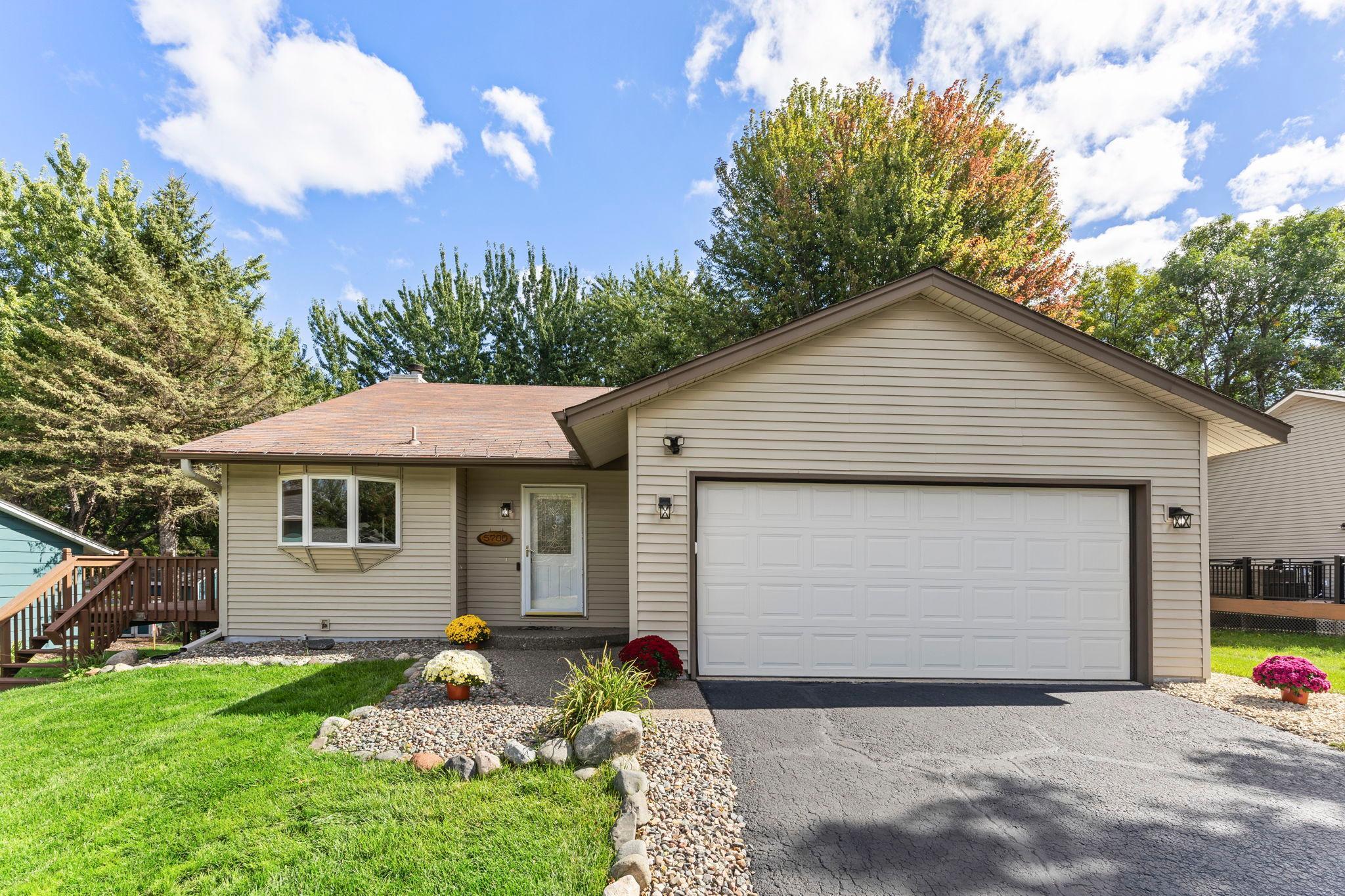 Welcome to this meticulously maintained 4-bedroom, 2-bathroom home in a desirable Shoreview neighborhood, just minutes from Turtle Lake Beach, the Shoreview Community Center, shopping, dining, and nearby parks and walking trails. Located within highly sought after Mounds View Public Schools district, with schools serving the area including Turtle Lake Elementary, Chippewa Middle School, and Mounds View High School. The functional layout features luxury plank flooring throughout the main living areas, brand-new stainless steel appliances, vaulted ceilings, and a bright dining area with access to a 15x12 deck. Upstairs offers three bedrooms with brand-new carpeting and a full bathroom, while the walkout lower level includes a spacious family room with a cozy wood-burning fireplace, a fourth bedroom, a ¾ bathroom, and a large laundry/storage room with a new washer and dryer (2025). Recent updates include a new furnace with humidifier (2023), A/C (2020), chimney inspection and cleaning (2026), all new interior and exterior light fixtures (2026), an app-controlled garage door opener, professional interior/exterior and window cleaning, and TruGreen lawn care since 2016. The home also includes a Standard Heating & Air Smart Club Membership, with one remaining HVAC tune-up included this winter, along with priority emergency service and waived service call fees. Don't miss this move-in-ready home in an exceptional location!