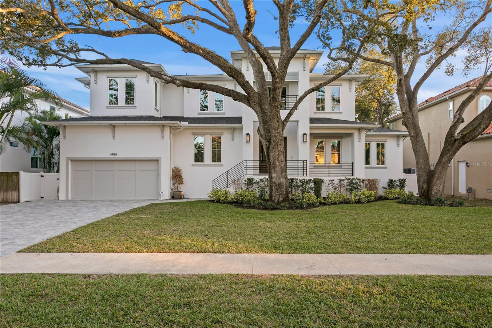 This custom-built Brookshire Homes residence showcases a thoughtfully designed floor plan that seamlessly balances elegance, comfort, and everyday functionality. Positioned on an expansive oversized lot measuring 90x143 (12,870 square feet) in the highly desirable Sunset Park neighborhood of South Tampa, the home offers 5 bedrooms, 6 full bathrooms, a dedicated office, a bonus room, a resort-style pool, and a four-car garage. A striking two-story foyer welcomes you inside, where soaring ceilings create an immediate sense of grandeur. The entry is flanked by a formal dining room and a private office or formal living space, perfectly placed for both entertaining and quiet productivity. Designed with livability in mind, the open-concept main living area and kitchen are filled with natural light from oversized windows and elegant French doors that frame serene views of the pool, lanai, and landscaped backyard. Throughout the home, custom finishes elevate the design, including hardwood floors, crown molding, coffered ceilings, and curated lighting. The chef’s kitchen is as functional as it is beautiful, featuring a six-burner gas range, oversized Thermador refrigerator, a large center island with generous storage, a hidden walk-in pantry with built-in shelving, an eat-in dining area, and a butler’s pantry with a full-size wine refrigerator. The adjacent living space is anchored by a gas fireplace, creating a warm and inviting hub for daily living and entertaining. The first-floor layout offers exceptional versatility, with a private guest suite featuring a marble-tiled en-suite bathroom, ideal for visitors or multigenerational living. A spacious bonus or flex room overlooks the pool and backyard and provides direct outdoor access, while a conveniently located pool bath, laundry room, mudroom, and additional storage enhance the home’s day-to-day functionality. Upstairs, the well-planned second level is anchored by the luxurious primary retreat, complete with a sitting area, spa-like en-suite bathroom, and an expansive walk-in closet with an island, designer built-ins, and direct access to the second-floor laundry room. Three additional upstairs bedrooms each include en-suite bathrooms with striking tile designs and custom storage, ensuring privacy and comfort for all. Designed for seamless indoor-outdoor living, the backyard retreat features a covered lanai, outdoor kitchen, and expansive pool deck—perfect for entertaining or relaxing in the Florida sunshine. Located on a quiet, upscale street within the sought-after Plant High School district, this exceptional home offers a prime South Tampa location with a floor plan that truly supports both refined living and everyday ease.