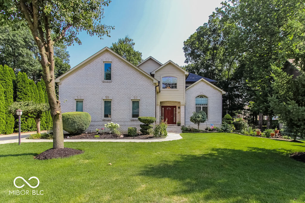 Welcome to 7619 Oak Grove Dr, a custom-made, beautifully updated home in the heart of Indianapolis! This spacious property offers the perfect blend of comfort, style, and thoughtful upgrades throughout. Highlights include a brand new master bathroom with walk-in closet, new carpet in the master and bedrooms 1-3, and a fully finished recreation room that can double as a bedroom. The basement features new carpet, vinyl plank flooring in the bedroom, and a wet bar with tile floor, ideal for entertaining.  The first-floor bathroom has been upgraded, and a sunroom and deck added in 2018 expand the living space. Throughout the home, you'll find Brazilian tigerwood cherry hardwood floors, high ceilings, and 5-piece oakwood crown molding with polyurethane finish. Additional features include solid hardwood doors, an extra-long driveway with basketball goal, and a finished garage with epoxy floor and an outdoor kitchen with cabinetry.  Other recent upgrades include a new sewer line and basement sump pump, new tile work, and custom solid cherry wood kitchen cabinets that add both charm and function.  This custom-built home is ideally located just minutes from major highways, top-rated Franklin Township schools, and all major grocery stores.  This home is a must-see: schedule your private tour today!
