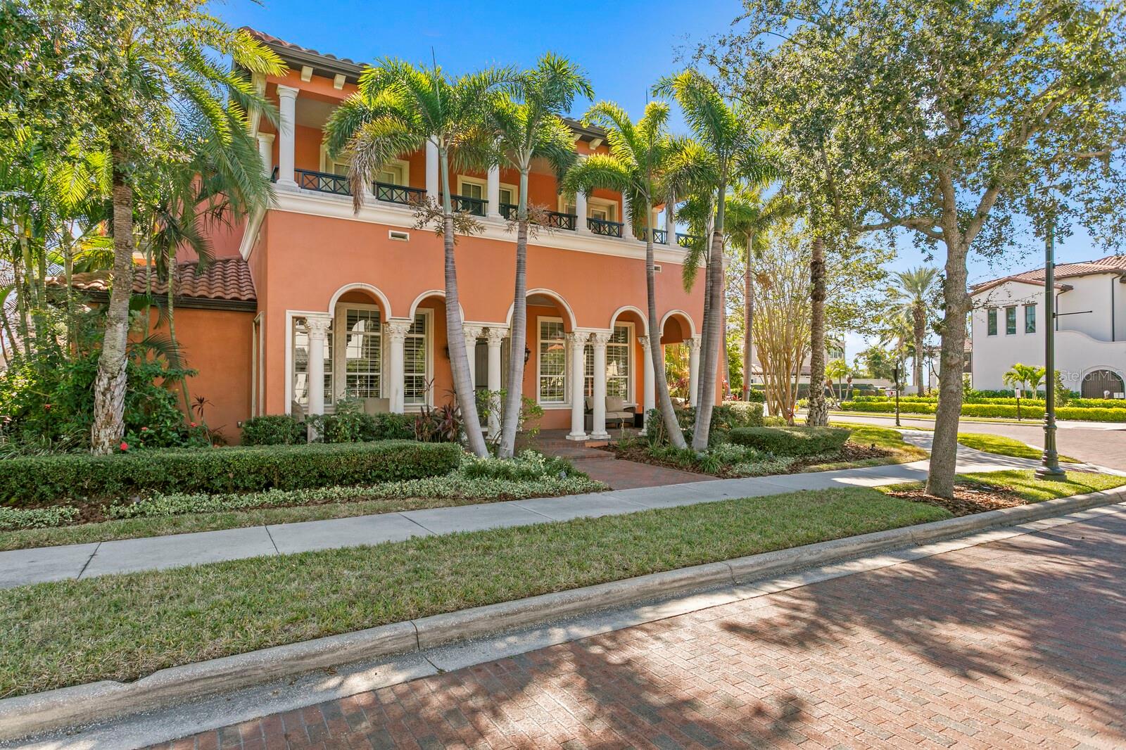 Perfectly positioned within the master-planned Westshore Yacht Club and backing to the community park, this exceptional residence offers refined coastal living in one of South Tampa’s most sought-after locations. Just steps from the Bay Club and marina, residents enjoy an exclusive waterfront lifestyle with guard-gated security, brick-lined streets, and sweeping Bayfront walkways. Inviting Mediterranean architecture welcomes you with an impressive temperature-controlled wine room that sets the tone for elevated entertaining. The thoughtful floor plan includes a formal dining room, formal living room, open-concept family room, breakfast room, and chef’s kitchen appointed with an expansive granite breakfast bar, stainless KitchenAid appliances, and natural gas cooking. A butler’s pantry just off the kitchen adds beverage refrigeration and prep space for effortless entertaining. Designed for seamless indoor–outdoor flow, the home is filled with natural light from transom windows and French doors. The private courtyard lanai offers lush landscaping, a saltwater pool, covered dining area, full pool bath, and expansive travertine paver deck. An outdoor kitchen with Viking appliances creates the perfect setting for year-round enjoyment. A first-floor guest suite includes an ensuite bath and pool access. Upstairs, the primary suite provides a private sanctuary with a generous terrace, luxurious bath, and large walk-in closet. The second level continues with a den/office and two additional guest suites, each with an ensuite bath and terrace access. An expansive media room features full wet bar, private entry from the pool/lanai staircase, and water view. Additional highlights include multiple terraces, hardwood flooring, plantation shutters, an elevator, three-car garage (with removal of partition wall), and ample storage throughout.Westshore Yacht Club offers an unparalleled waterfront lifestyle with exclusive access to the premier Bay Club, a full-service 149-slip marina, two resort-style pools, state-of-the-art fitness center, spa, and more. Enjoy manicured streets, numerous parks and walking trails, and a vibrant Marina District with shopping, dining, and entertainment—all just minutes from Tampa International Airport, downtown Tampa, and St. Petersburg.