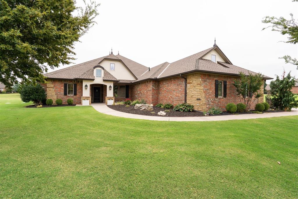 Impeccably cared for, this home remains in pristine condition with every detail beautifully preserved. One owner Custom Home on 1 Acre in Deer Creek Schools! This stunning 4-bedroom, 4.5-bath home was thoughtfully designed with quality, efficiency, and comfort in mind. Built with 2x6 exterior walls, post-tension slab, and Energy Star-rated windows and doors, it offers long-term durability and low utility costs. Inside, you’ll find exceptional craftsmanship—cabinetry with dovetail drawers, soft-close doors, pull-out shelving, high end finishes, and beautiful stained and painted woodwork throughout. The open floor plan features three living areas, a spacious kitchen with an island, walk-in pantry, stone finished breakfast bar, and stainless appliances, plus two fireplaces for cozy evenings. The primary suite includes double vanities, dressing vanity, whirlpool tub, and large walk-in closet with lots of built ins, while each secondary bedroom offers its own full bath, ceiling fan and walk-in closet. Upstairs, the bonus room has brand-new carpet and endless flexibility for a game room, gym, media space or even a 5th bedroom. Enjoy outdoor living year-round with a spacious covered patio area and an outdoor fireplace overlooking beautifully maintained landscaping designed for privacy. Recent upgrades include custom Hunter Douglas wood blinds and sheer solar shades, a Culligan water softener, and an in-ground storm shelter in the garage. A highlight for car and truck enthusiasts—the oversized 3-car garage measures an impressive 1,012 sq ft, with 90-inch garage door height and up to 27 feet in depth, perfect for large pickups, SUVs, or even a boat. Located in a quiet neighborhood with a greenbelt and just minutes from schools, shopping, and dining, this home offers the ideal blend of rural space and Edmond convenience. It truly shows like new and is move-in ready!