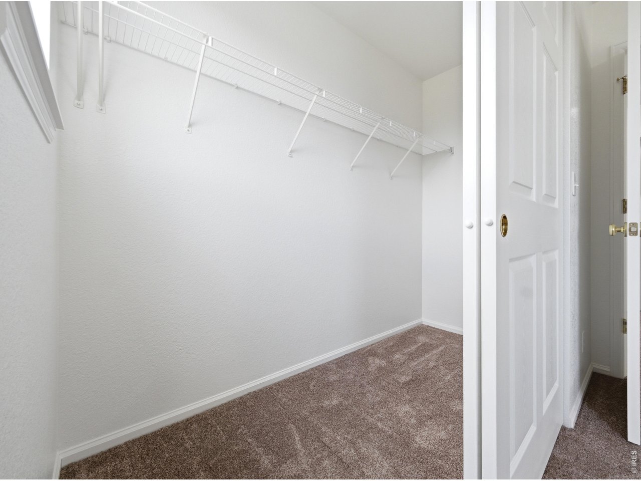 Enjoy open space, mountain views, nearby parks and trails, and convenient access to shopping, restaurants, recreation, and major routes from 6375 E 139th Ave in Thornton's Springvale neighborhood. Positioned on a spacious corner lot beside open space, this 2 story home features a newly sodded yard, an oversized 3 car attached garage, and an additional concrete parking pad. The covered front porch creates a welcoming entrance and an inviting outdoor space for morning coffee or Colorado evenings. Inside, the bright, open floor plan features hardwood flooring across the main living areas. The spacious kitchen offers abundant cabinetry, stainless steel appliances, recessed lighting, a breakfast bar, and an open connection to the dining area and main living room. A white brick fireplace anchors the living room, while multiple windows bring in natural light and frame views of the landscaped yard. A sliding glass door connects the dining area to the backyard patio, creating easy access for outdoor dining, grilling, gardening, and entertaining. The main level also includes a powder Bath and laundry room. Upstairs, the flexible loft provides options for an office, media area, game room, hobby room, or additional living space. The spacious Primary Suite includes multiple windows, a large walk in closet, and an updated private Bath with dual sinks and a tiled shower. The secondary Beds offer generous closet space and share an updated full Bath with subway tile. The unfinished basement includes multiple windows and provides substantial storage plus room to create additional Beds, a Bath, gym, recreation area, or living space. The oversized garage features coated floors, separate garage doors, and direct interior access. With open space beside the property, mountain views, flexible indoor areas, outdoor living space, extra parking, and proximity to Thornton amenities and the Denver Metro area, this home offers space to live, gather, work, and recharge.